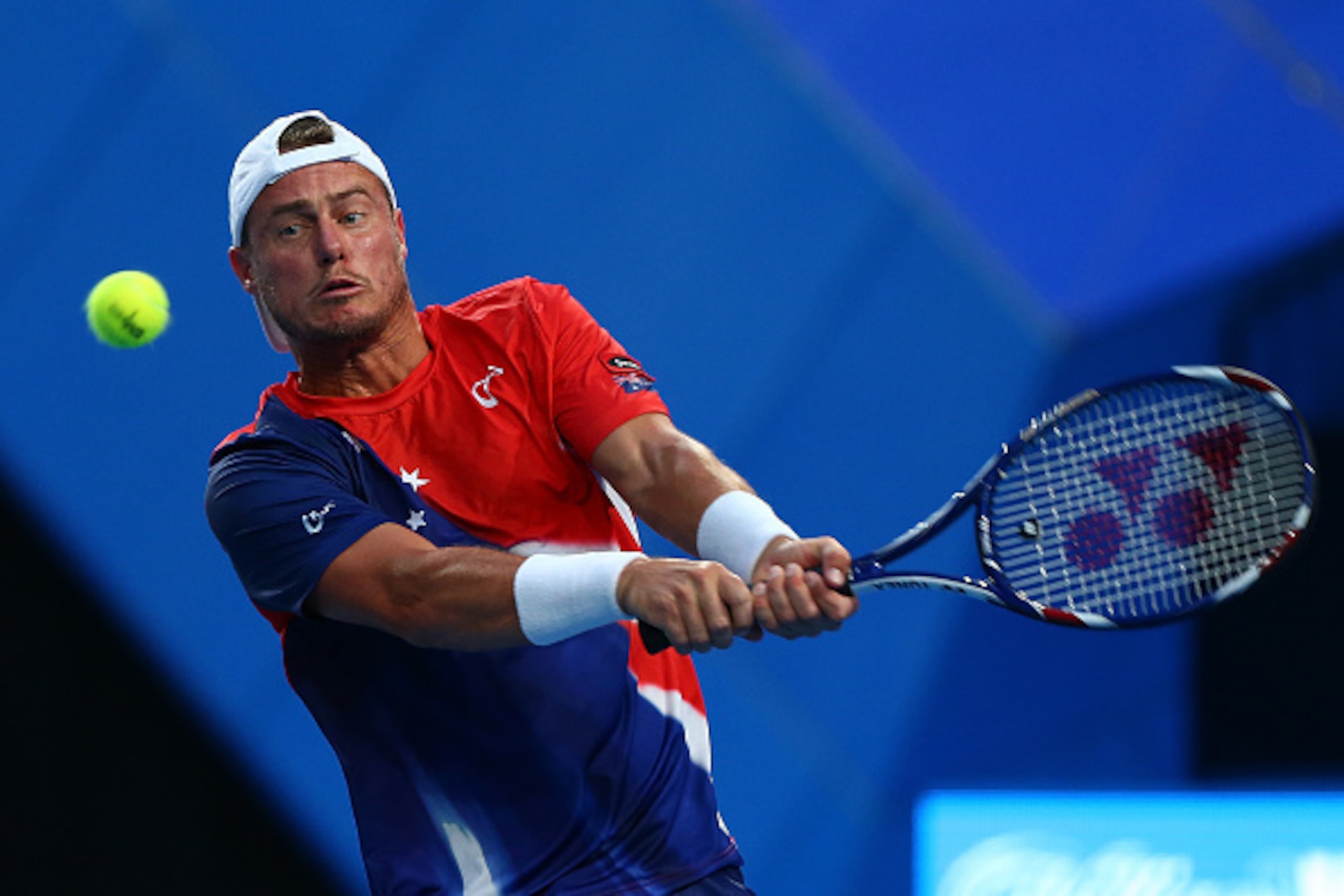 PERTH, AUSTRALIA - JANUARY 05:  Lleyton Hewitt of Australia Gold plays a backhand to Jack Sock of the United States in his singles match during day three of the 2016 Hopman Cup at Perth Arena on January 5, 2016 in Perth, Australia.  (Photo by Paul Kane/Ge