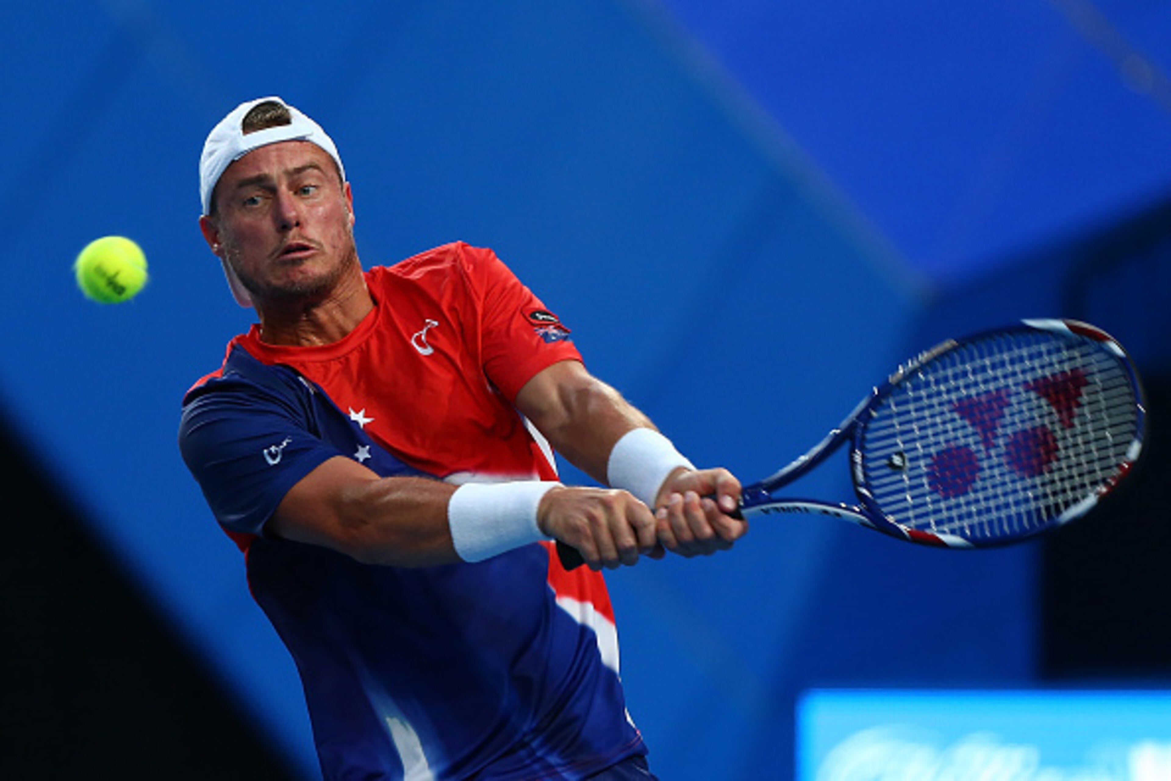 PERTH, AUSTRALIA - JANUARY 05:  Lleyton Hewitt of Australia Gold plays a backhand to Jack Sock of the United States in his singles match during day three of the 2016 Hopman Cup at Perth Arena on January 5, 2016 in Perth, Australia.  (Photo by Paul Kane/Ge