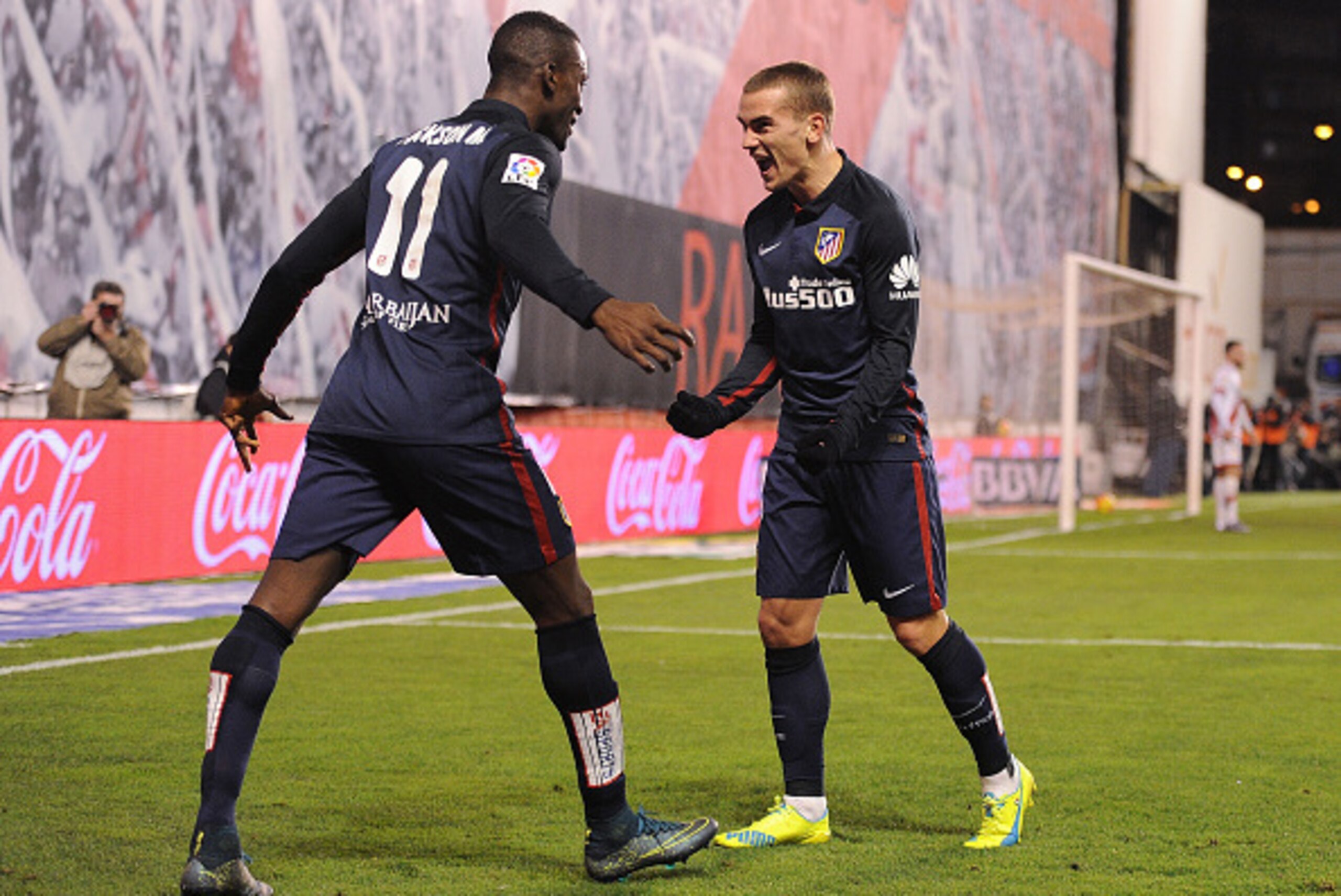 MADRID, SPAIN - DECEMBER 30:   Antoine Greizmann of Club Atletico de Madrid celebrates with Jackson Martinez after scoring Atletico's 2nd goal  during the La Liga match between Rayo Vallecano and Club Atletico de Madrid at Estadio de Vallecas on December 