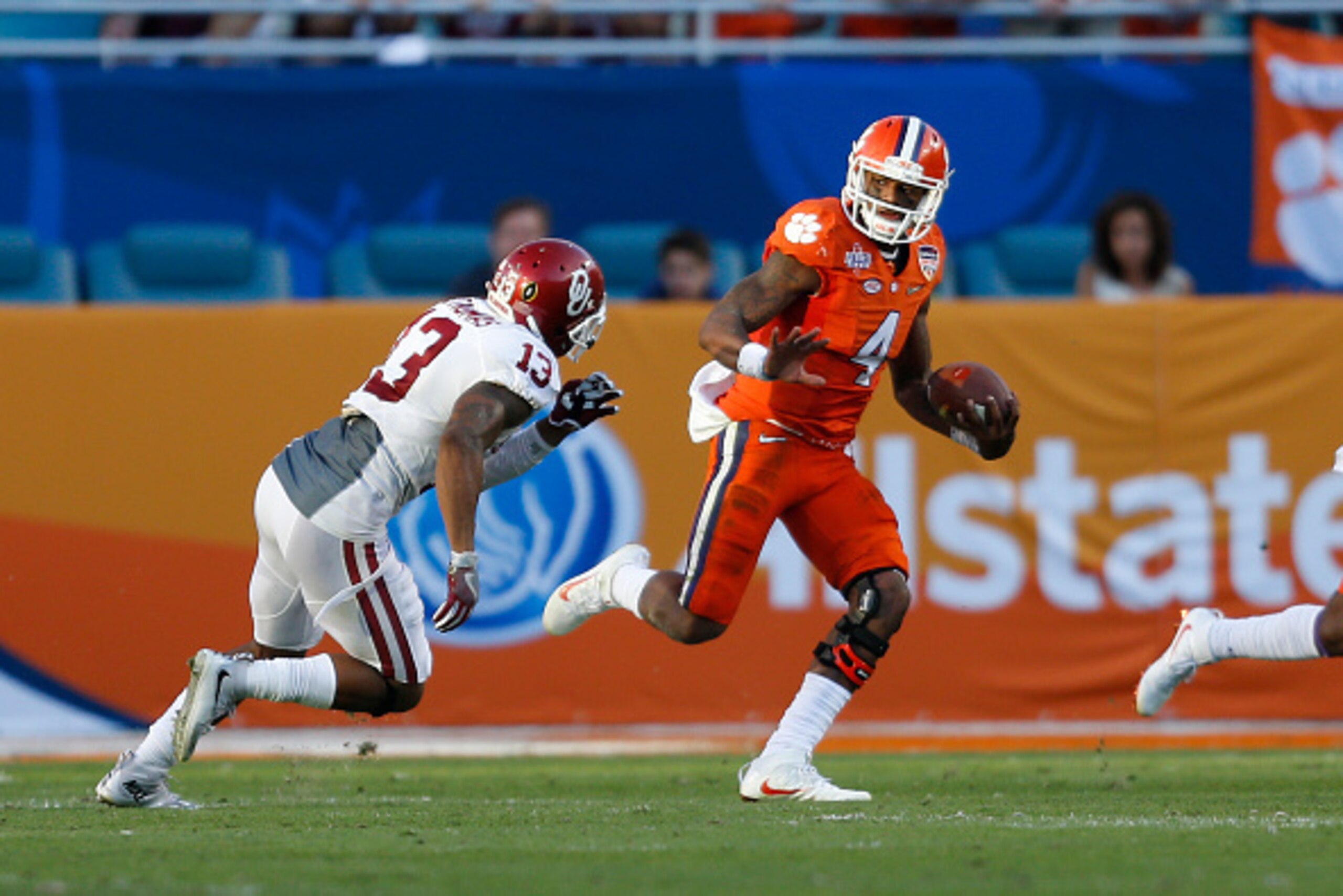 MIAMI GARDENS, FL - DECEMBER 31: Ahmad Thomas #13 of the Oklahoma Sooners pursues Deshaun Watson #4 of the Clemson Tigers during the 2015 Capital One Orange Bowl at Sun Life Stadium on December 29, 2015 in Miami Gardens, Florida. Clemson defeated Oklahoma