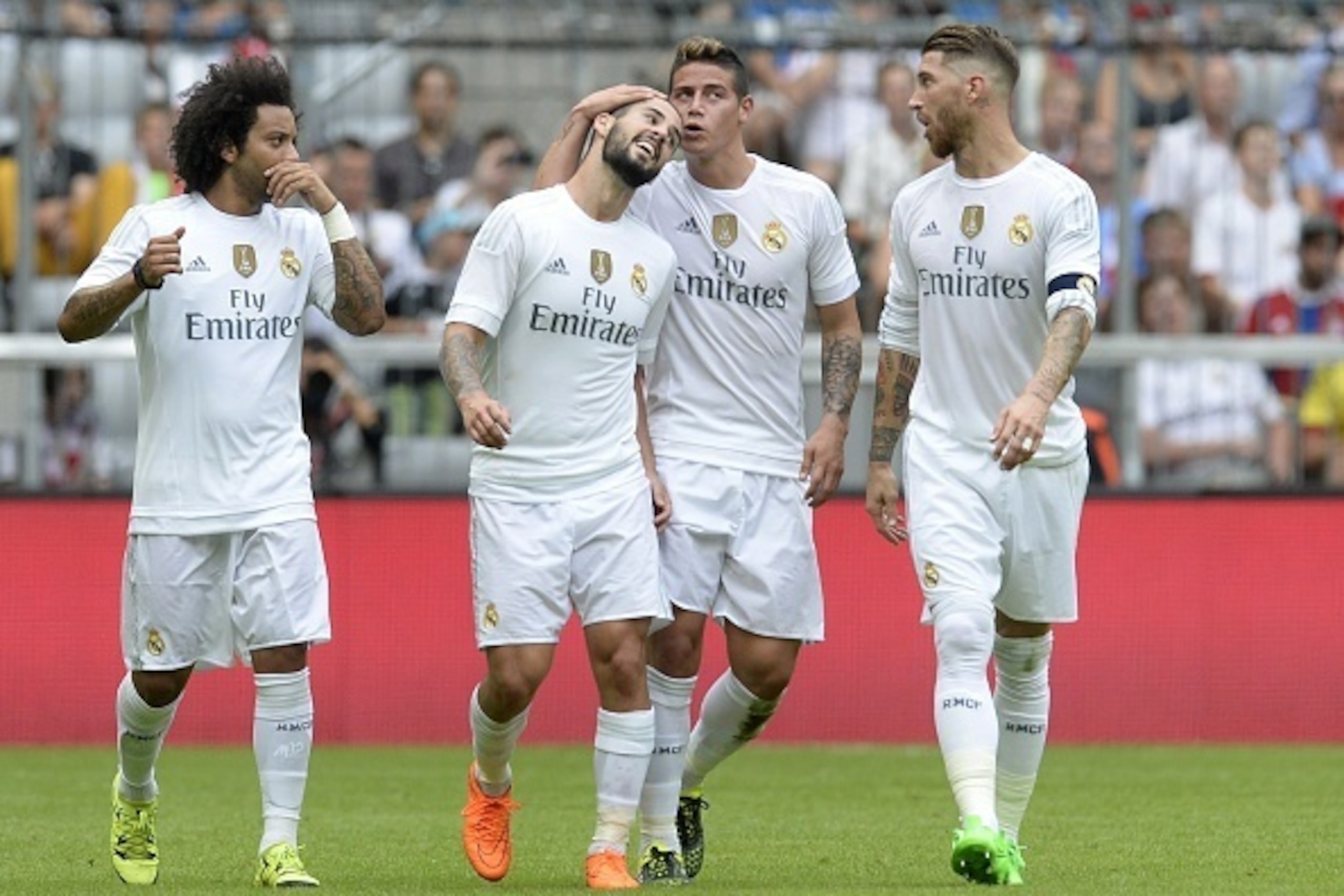(L-R) Real Madrid's Brazilian defender Marcelo, Real Madrid's midfielder Isco, Real Madrid's Columbian midfielder James and Real Madrid's defender Sergio Ramos celebrates scoring  during the Audi Cup football match Real Madrid vs Tottenham Hotspur in Muni