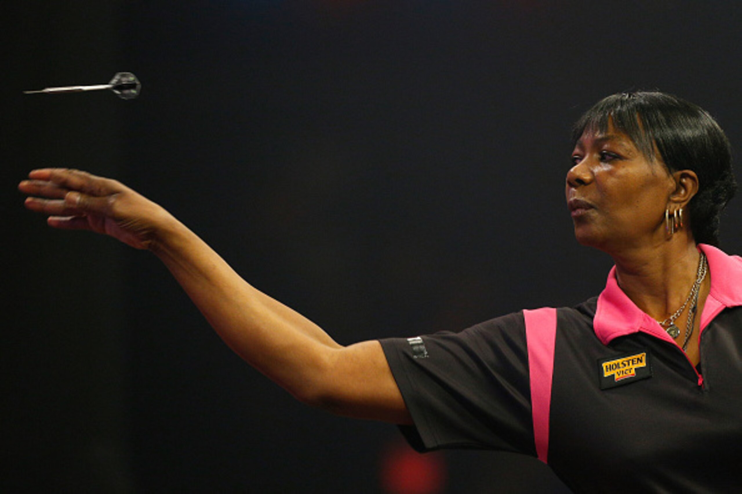 FRIMLEY, ENGLAND - JANUARY 03: Deta Hedman of England throws during her first round match against Lisa Ashton of England on day one of the BDO Lakeside World Professional Darts Championships at the Lakeside Complex on January 3, 2015 in Frimley, England. 