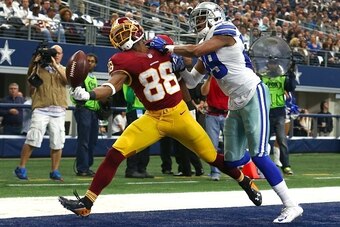 ARLINGTON, TX - JANUARY 03: Pierre Garcon #88 of the Washington Redskins attempts to make a touchdown catch against Deji Olatoye #29 of the Dallas Cowboys during the first  half at AT&T Stadium on January 3, 2016 in Arlington, Texas. (Photo by Tom Penning