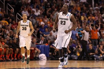 PHOENIX, AZ - MARCH 22:  (R-L) Draymond Green #23 and Brandon Wood #30 of the Michigan State Spartans react in the first half while taking on the Louisville Cardinals during the 2012 NCAA Men's Basketball West Regional Semifinal game at US Airways Center 