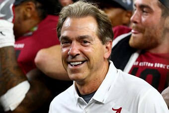 ARLINGTON, TX - DECEMBER 31:  Head coach Nick Saban of the Alabama Crimson Tide celebrates with the trophy after defeating the Spartans 38 to 0 in the Goodyear Cotton Bowl at AT&T Stadium on December 31, 2015 in Arlington, Texas.  (Photo by Ronald Martine