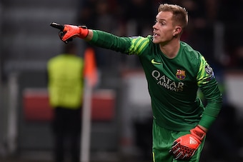 Barcelona's German goalkeeper Marc-Andre Ter Stegen reacts during the Group E, second-leg UEFA Champions League football match Bayer 04 Leverkusen vs FC Barcelona in Leverkusen, western Germany on December 9, 2015.  / AFP / PATRIK STOLLARZ        (Photo c