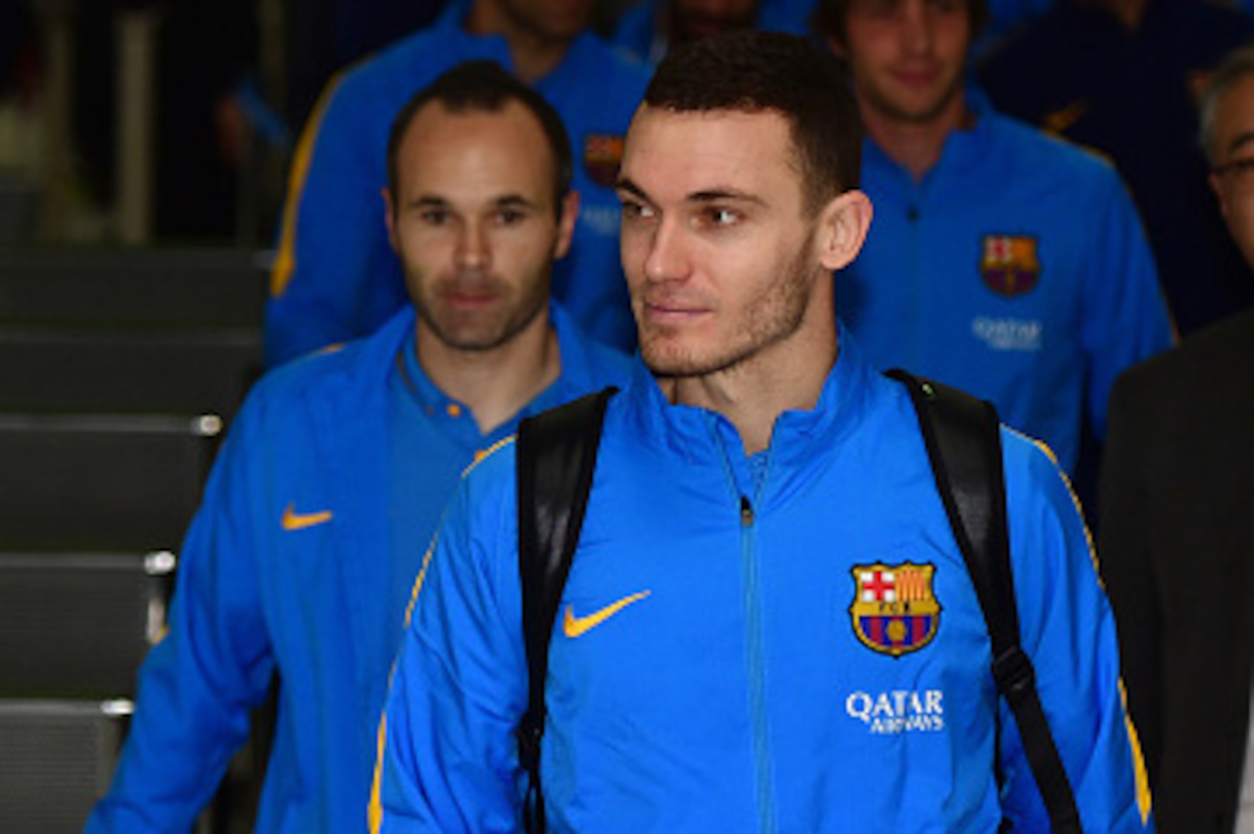 Spain's FC Barcelona football players Sergio Busquets (L), Andres Iniesta (C) and Thomas Vermaelen (R) arrive at the Narita international airport in Narita, suburban Tokyo on December 14, 2015. FC Barcelona will play against Asian champion Guagzhou Evergr