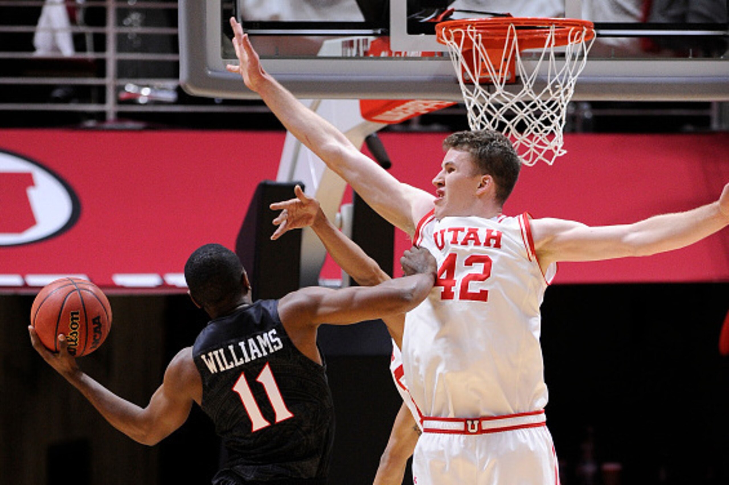 SALT LAKE CITY, UT- NOVEMBER 16: Jakob Poeltl #42 of the Utah Utes defends against D'Erryl Williams #11 of the San Diego State Aztecs at the Jon M. Huntsman Center on November 16, 2015 in Salt Lake City, Utah. (Photo by Gene Sweeney Jr/Getty Images)