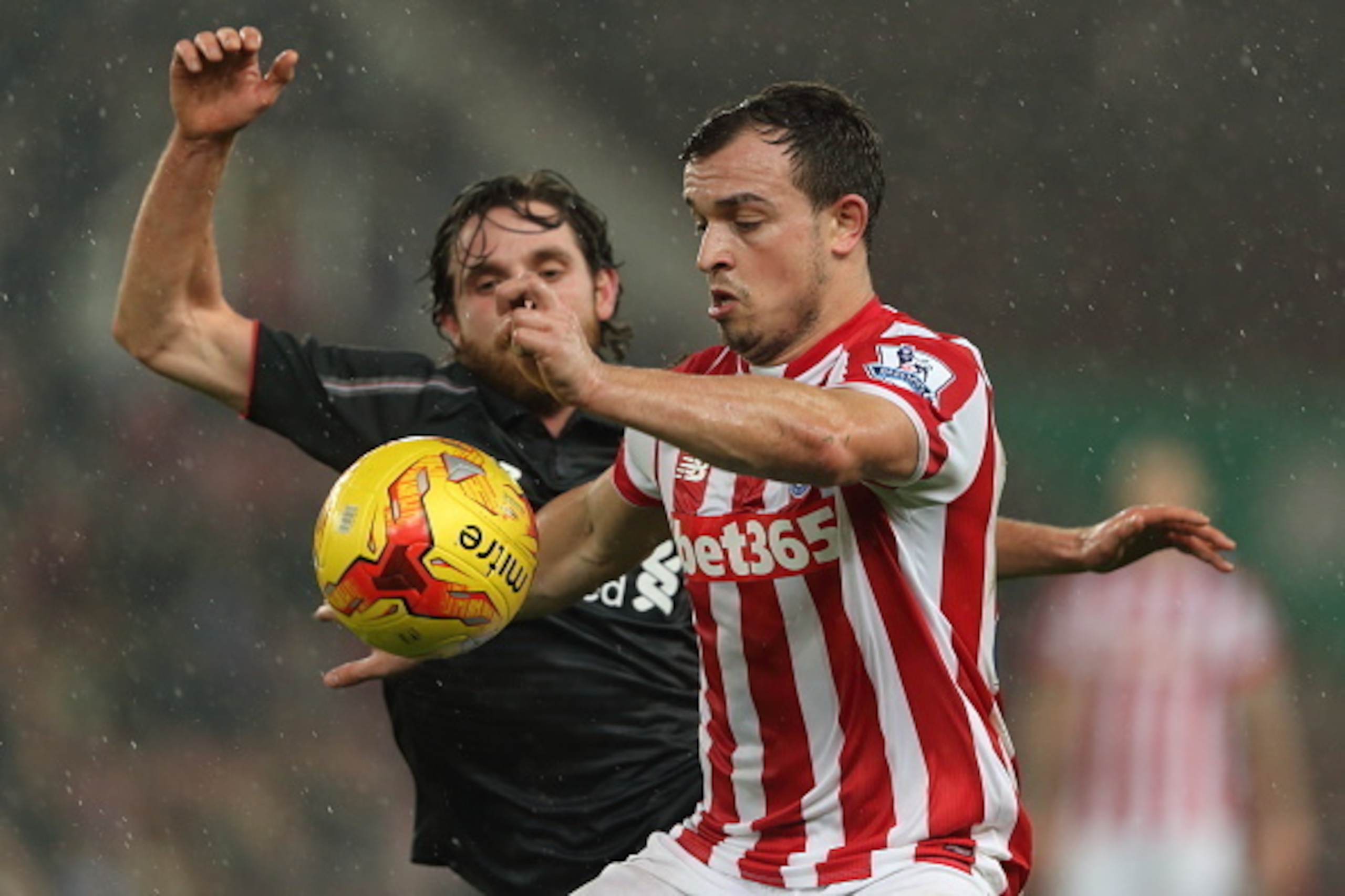 STOKE ON TRENT, ENGLAND - JANUARY 05: Joe Allen of Liverpool and Xherdan Shaqiri of Stoke City during the Capital One Cup Semi Final, First Leg, between Stoke City and Liverpool at Britannia Stadium on January 5, 2016 in Stoke on Trent, England. (Photo b STOKE ON TRENT, ENGLAND - JANUARY 05: Joe Allen of Liverpool and Xherdan Shaqiri of Stoke City during the Capital One Cup Semi Final, First Leg, between Stoke City and Liverpool at Britannia Stadium on January 5, 2016 in Stoke on Trent, England. (Photo b