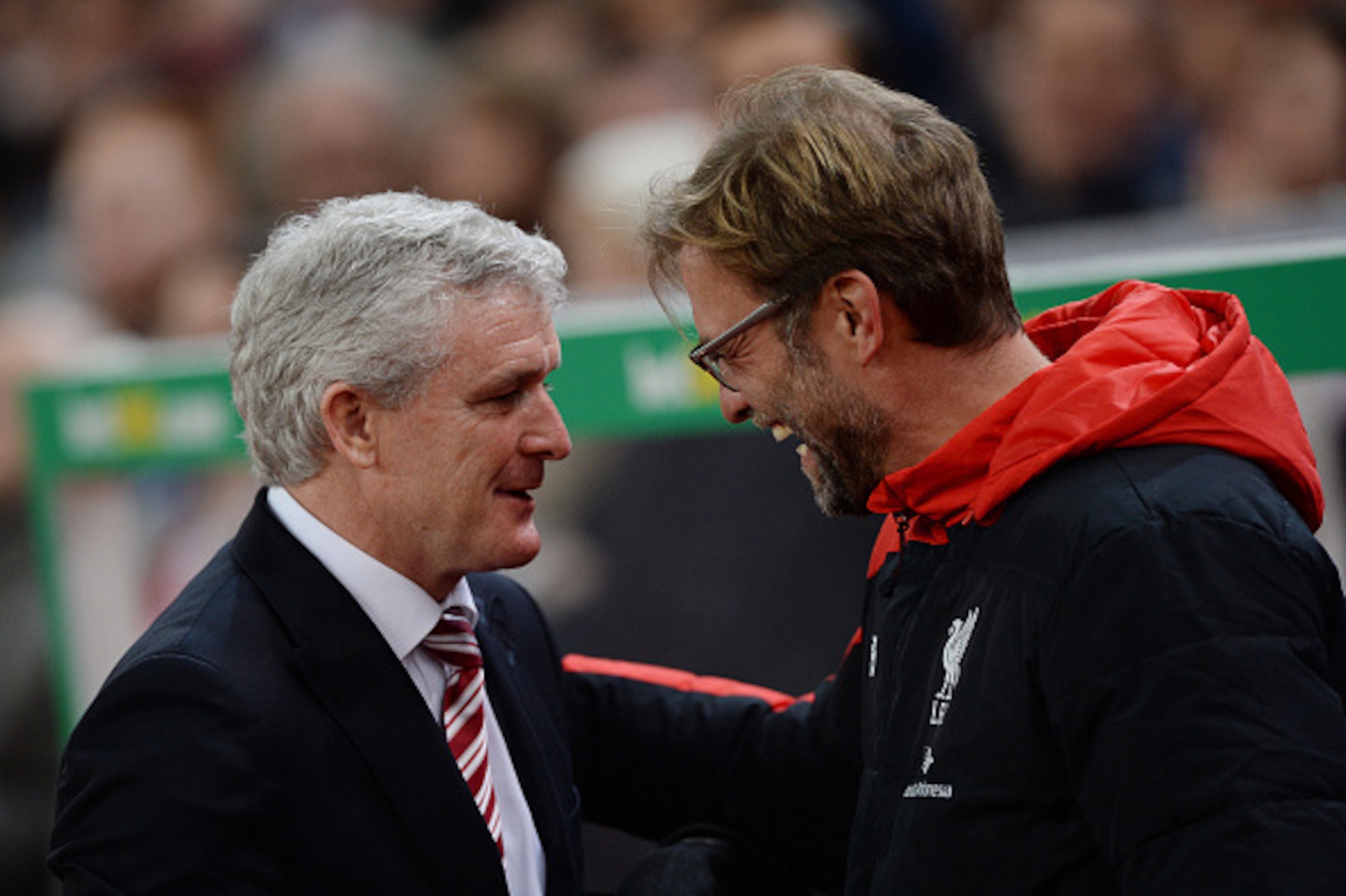 STOKE ON TRENT, ENGLAND - JANUARY 05: Jurgen Klopp (R), Manager of Liverpool is greeted by Mark Hughes the Manager of Stoke City during the Capital One Cup semi final, first leg match between Stoke City and Liverpool at the Britannia Stadium on January 5 STOKE ON TRENT, ENGLAND - JANUARY 05: Jurgen Klopp (R), Manager of Liverpool is greeted by Mark Hughes the Manager of Stoke City during the Capital One Cup semi final, first leg match between Stoke City and Liverpool at the Britannia Stadium on January 5