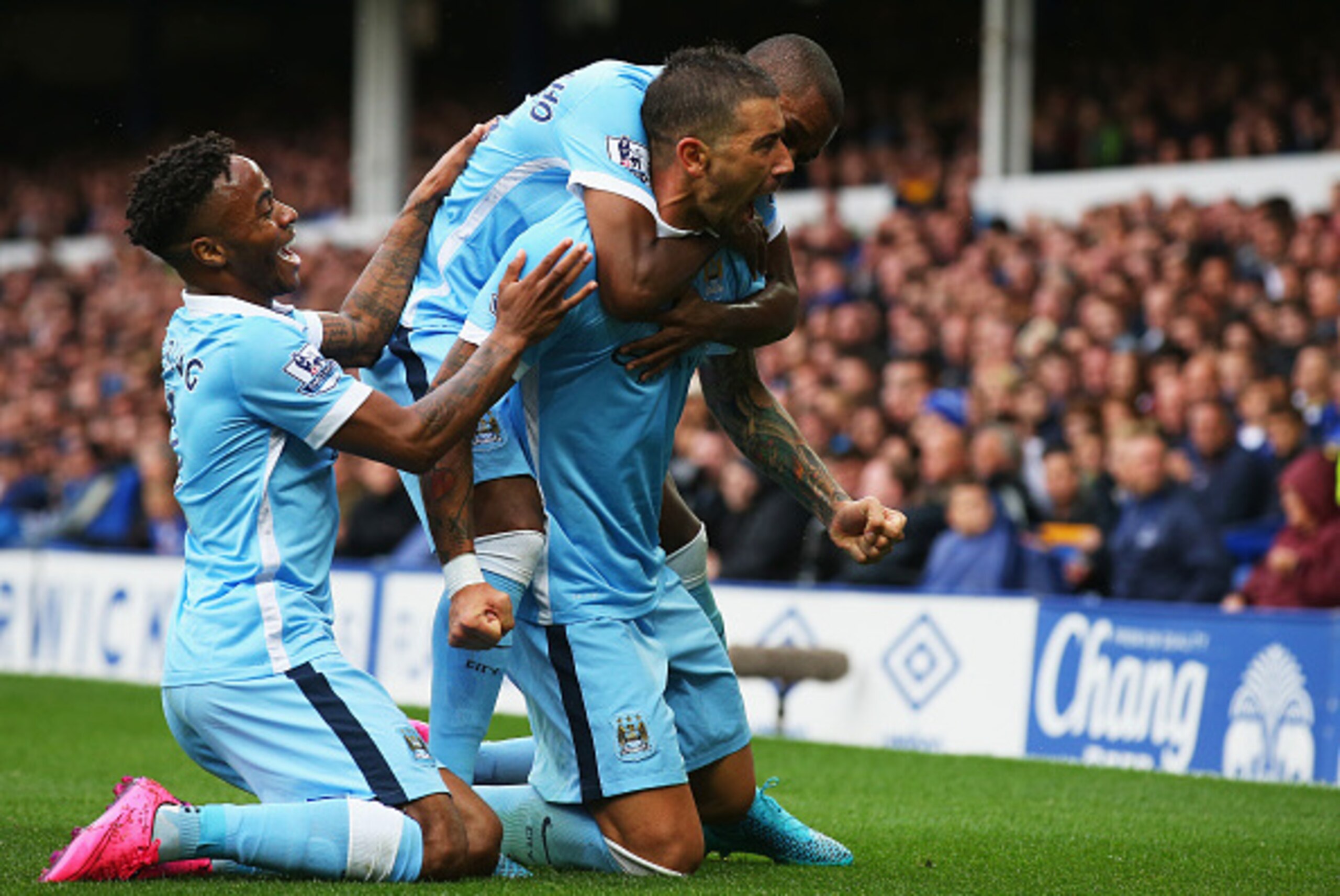 LIVERPOOL, ENGLAND - AUGUST 23:  Aleksandar Kolarov of Manchester City celebrates scoring the opening goal with Raheem Sterling (L) during the Barclays Premier League match between Everton and Manchester City at Goodison Park on August 23, 2015 in Liverpo