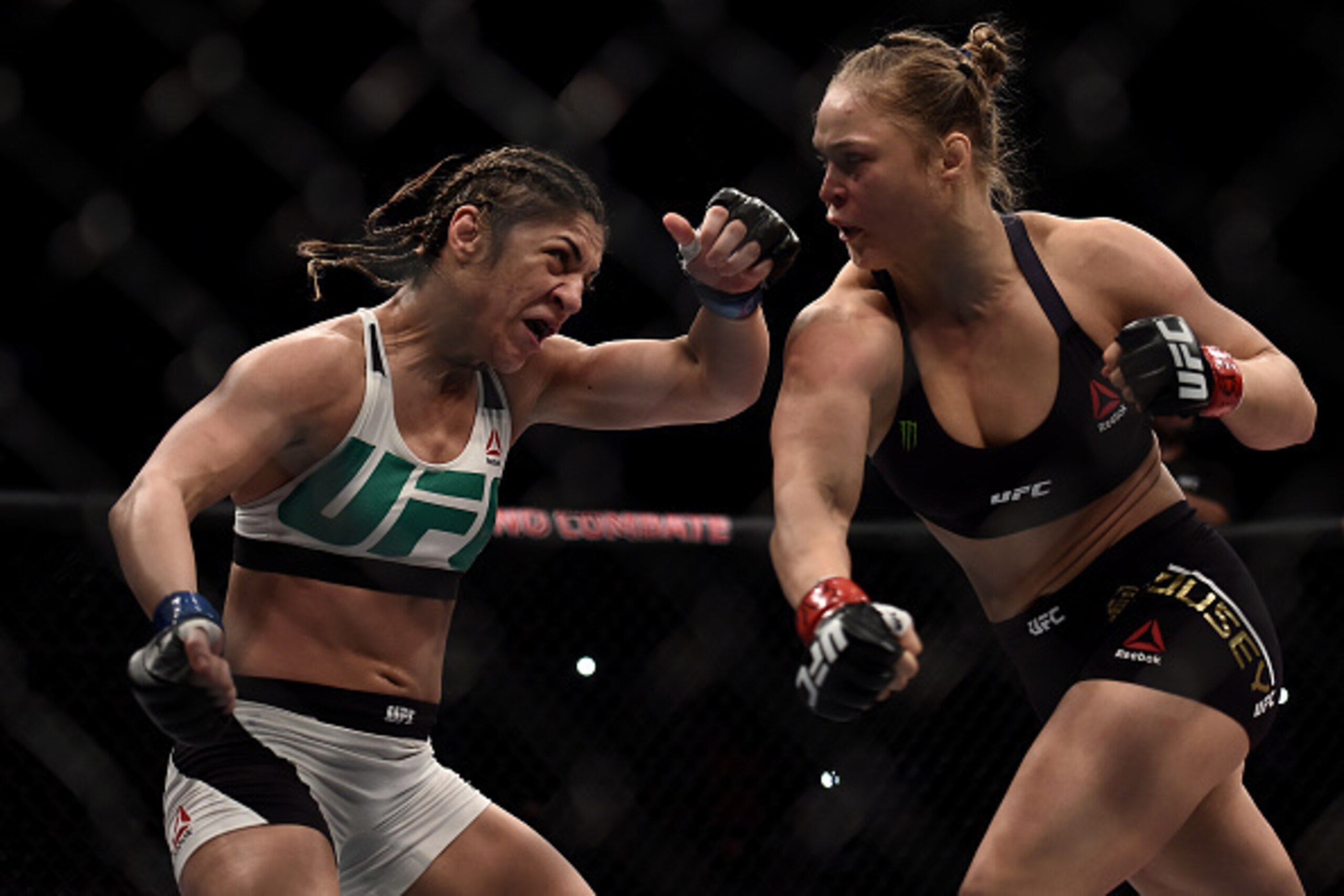 RIO DE JANEIRO, BRAZIL - AUGUST 01:  Ronda Rousey of the United States punches Bethe Correia of Brazil in their bantamweight title fight during the UFC 190 Rousey v Correia at HSBC Arena on August 1, 2015 in Rio de Janeiro, Brazil.  (Photo by Buda Mendes/