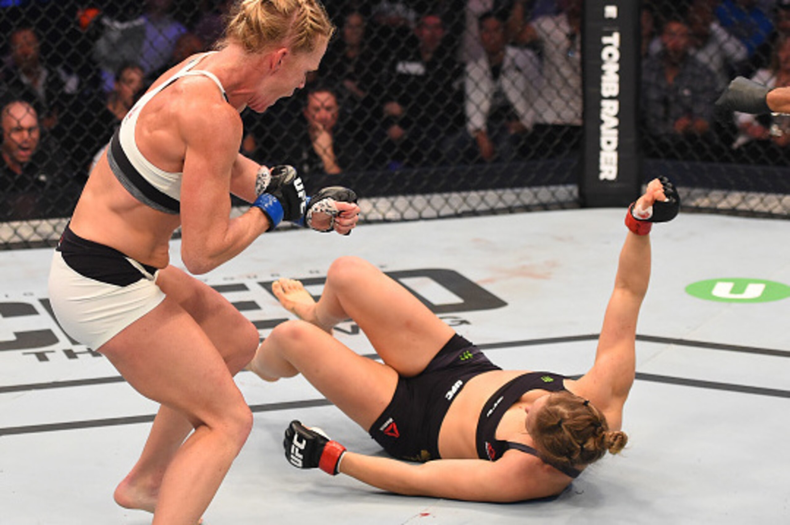 MELBOURNE, AUSTRALIA - NOVEMBER 15:  (L-R) Holly Holm of the United States follows up after knocking down Ronda Rousey of the United States with a kick in their UFC women's bantamweight championship bout during the UFC 193 event at Etihad Stadium on Novem