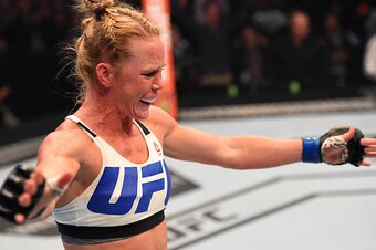 MELBOURNE, AUSTRALIA - NOVEMBER 15:  Holly Holm of the United States celebrates after her knockout victory over Ronda Rousey of the United States in their UFC women's bantamweight championship bout during the UFC 193 event at Etihad Stadium on November 15