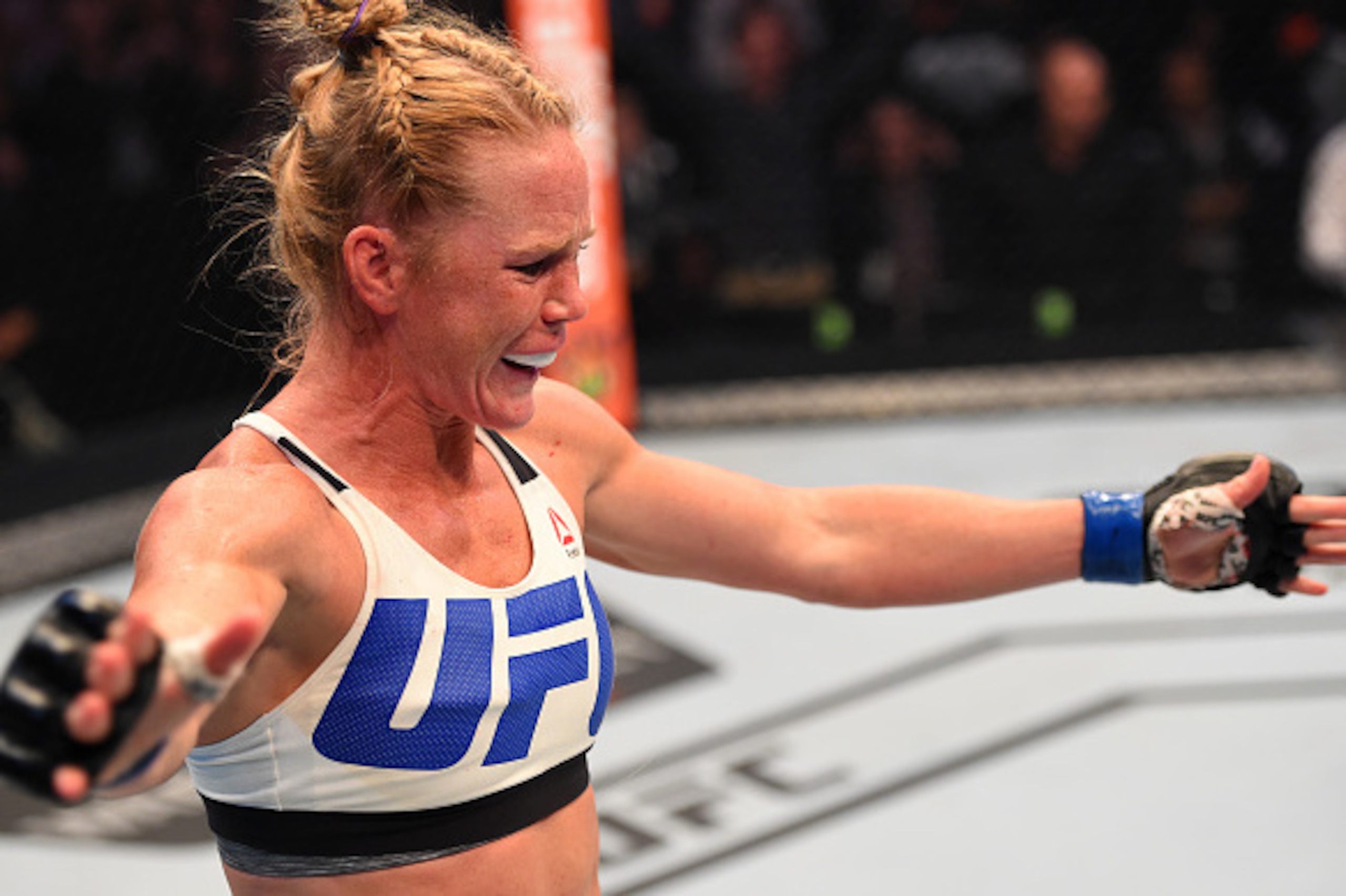 MELBOURNE, AUSTRALIA - NOVEMBER 15:  Holly Holm of the United States celebrates after her knockout victory over Ronda Rousey of the United States in their UFC women's bantamweight championship bout during the UFC 193 event at Etihad Stadium on November 15