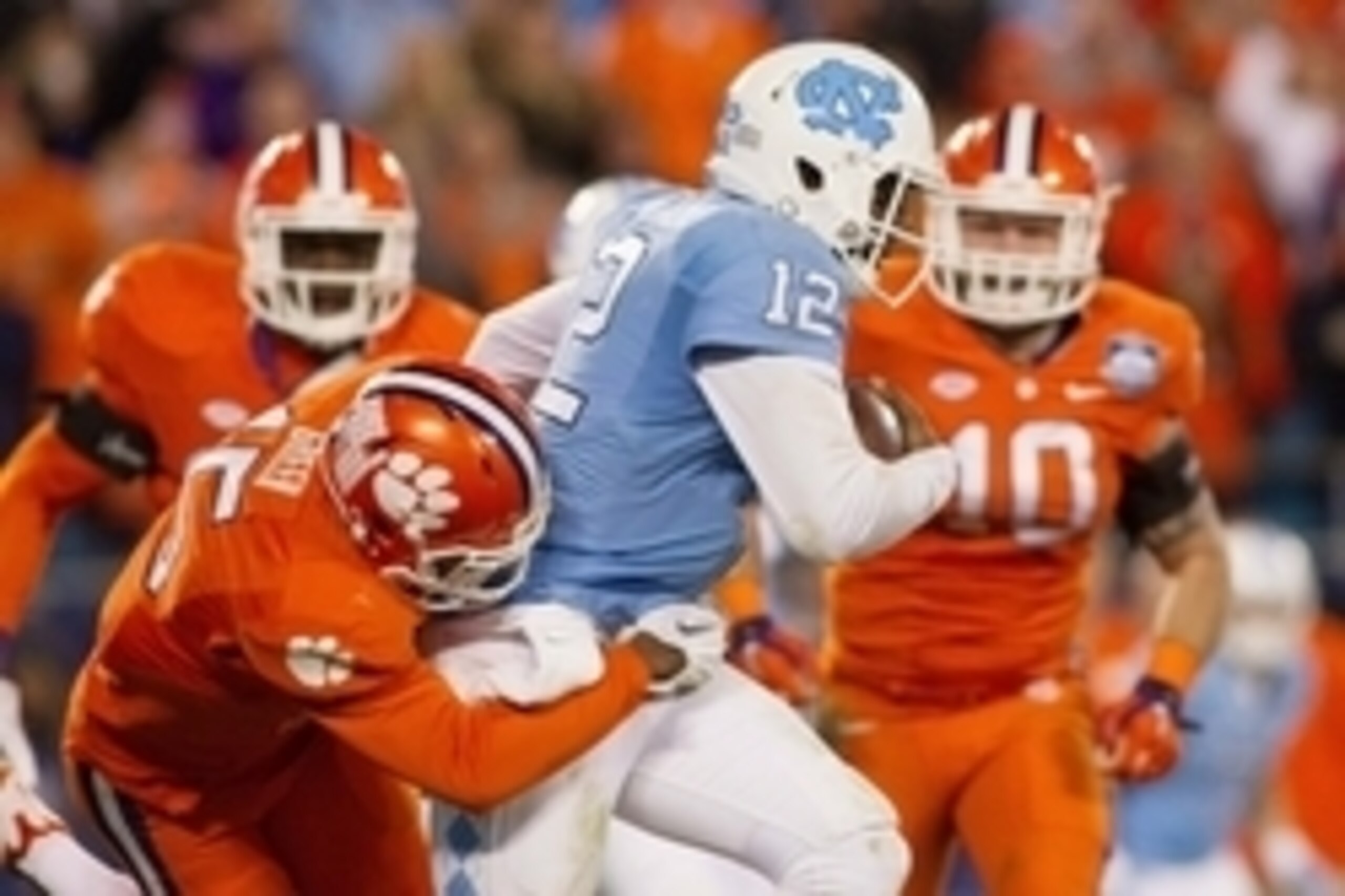 Dec 5, 2015; Charlotte, NC, USA; North Carolina Tar Heels quarterback Marquise Williams (12) is sacked by Clemson Tigers safety T.J. Green (15) during the second quarter in the ACC football championship game at Bank of America Stadium. Mandatory Credit: J Dec 5, 2015; Charlotte, NC, USA; North Carolina Tar Heels quarterback Marquise Williams (12) is sacked by Clemson Tigers safety T.J. Green (15) during the second quarter in the ACC football championship game at Bank of America Stadium. Mandatory Credit: J