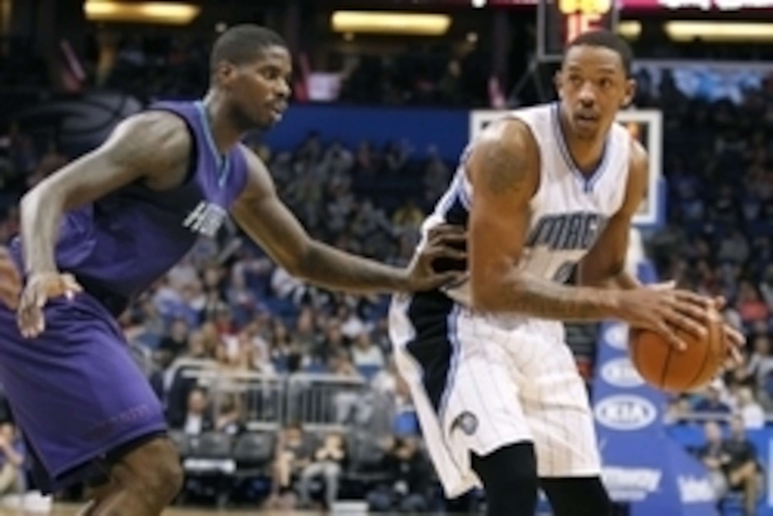 Dec 16, 2015; Orlando, FL, USA; Orlando Magic forward Channing Frye (8) looks to pass around Charlotte Hornets forward Marvin Williams (left) during the second half of an NBA basketball game at Amway Center. The Orlando Magic won 113-98. Mandatory Credit:
