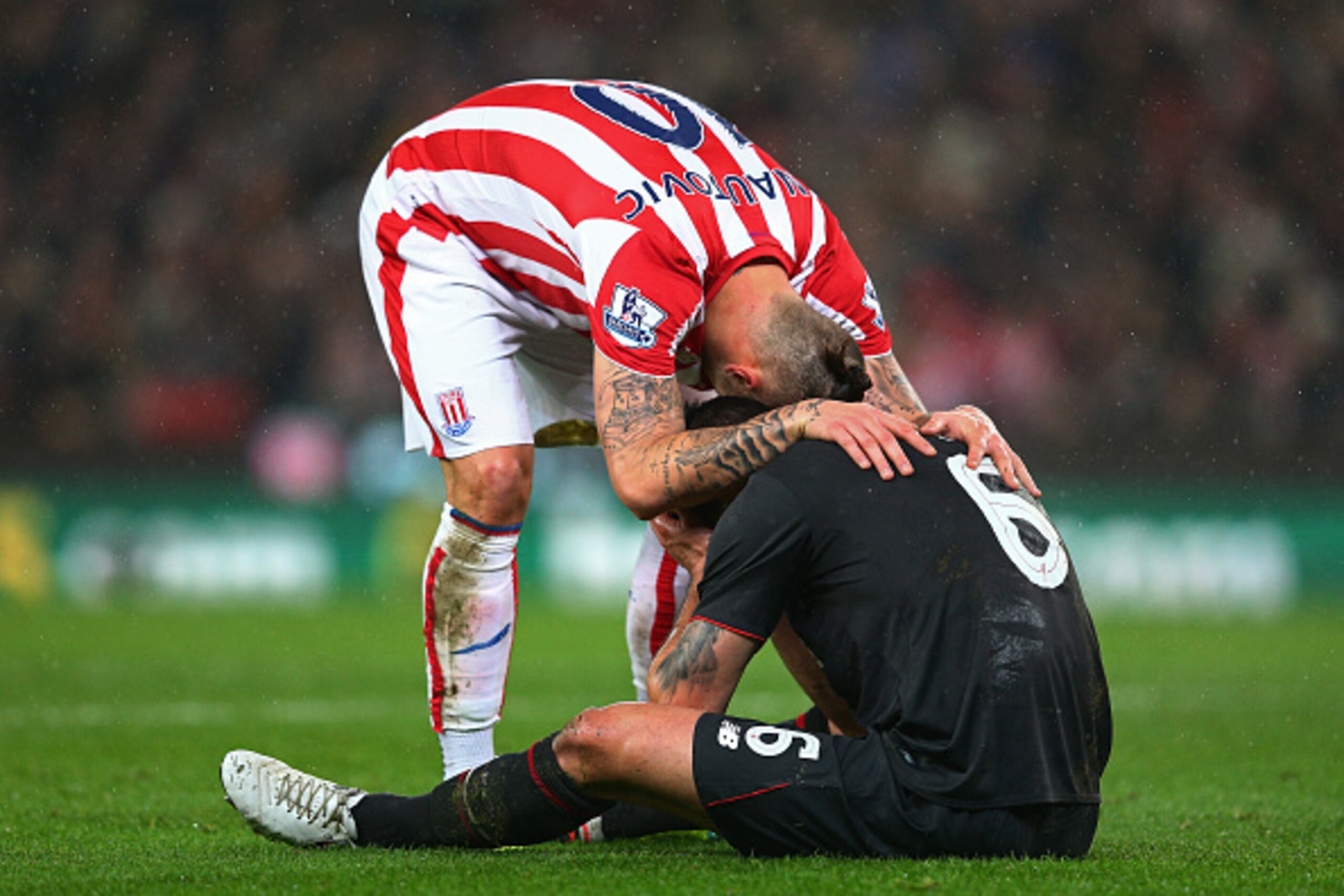 STOKE ON TRENT, ENGLAND - JANUARY 05: Marko Arnautovic of Stoke City and Dejan Lovren of Liverpool react during the Capital One Cup semi final, first leg match between Stoke City and Liverpool at the Britannia Stadium on January 5, 2016 in Stoke on Trent STOKE ON TRENT, ENGLAND - JANUARY 05: Marko Arnautovic of Stoke City and Dejan Lovren of Liverpool react during the Capital One Cup semi final, first leg match between Stoke City and Liverpool at the Britannia Stadium on January 5, 2016 in Stoke on Trent