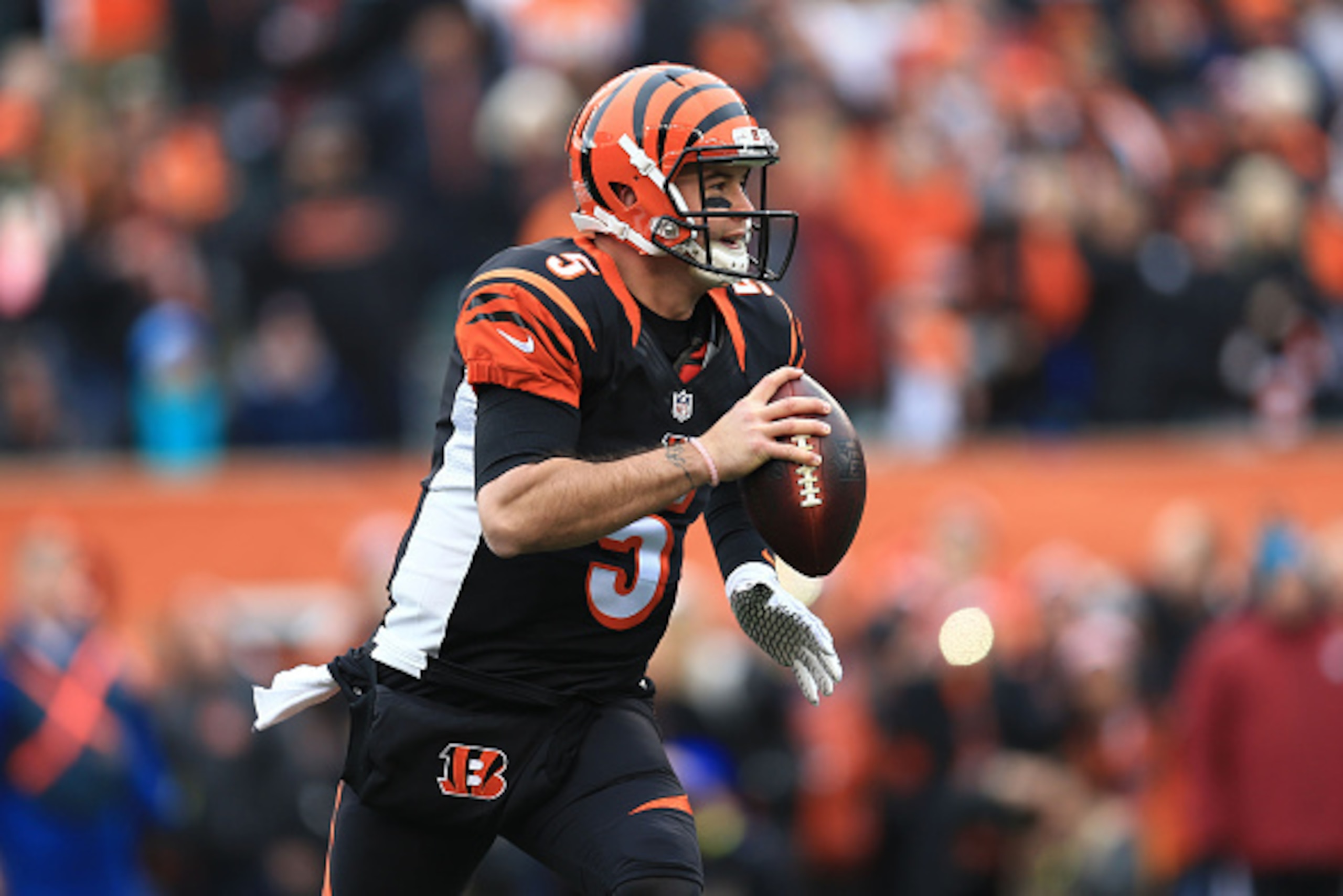 CINCINNATI, OH - JANUARY 3: Quarterback AJ McCarron #5 of the Cincinnati Bengals scrambles out of the pocket during the first quarter against the Baltimore Ravens at Paul Brown Stadium on January 3, 2016 in Cincinnati, Ohio. (Photo by Andrew Weber/Getty I