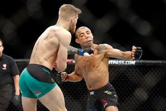 McGregor (left) knocked out Aldo in 13 seconds.