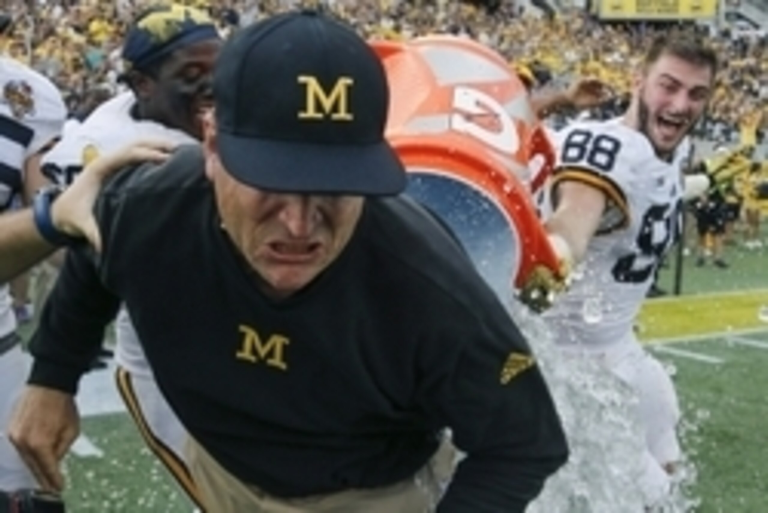 Jan 1, 2016; Orlando, FL, USA; Michigan Wolverines head coach Jim Harbaugh gets a Gatorade bath after the Michigan Wolverines defeated the Florida Gators 41-7 in the 2016 Citrus Bowl at Orlando Citrus Bowl Stadium. Mandatory Credit: Reinhold Matay-USA TOD