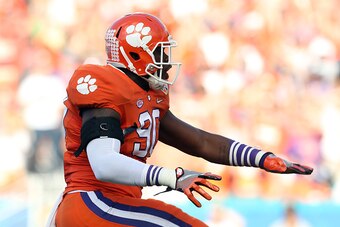 MIAMI GARDENS, FL - DECEMBER 31:  Shaq Lawson #90 of the Clemson Tigers reacts after Baker Mayfield #6 of the Oklahoma Sooners (not pictured) is sacked in the first quarter during the 2015 Capital One Orange Bowl at Sun Life Stadium on December 31, 2015 i