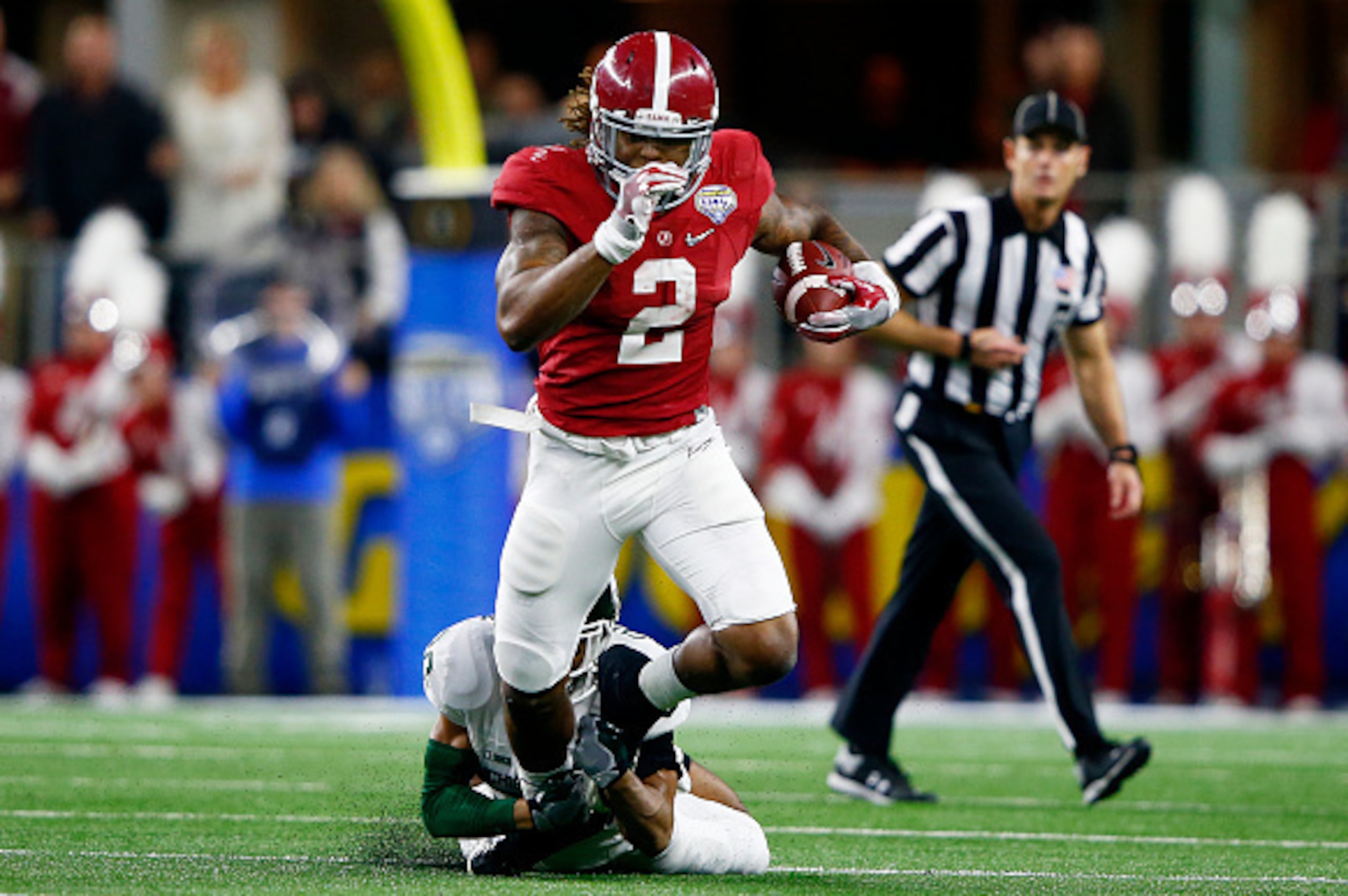 ARLINGTON, TX - DECEMBER 31:  Running back Derrick Henry #2 of the Alabama Crimson Tide runs the ball ahead of cornerback Arjen Colquhoun #36 of the Michigan State Spartans in the second quarter during the Goodyear Cotton Bowl at AT&T Stadium on December 