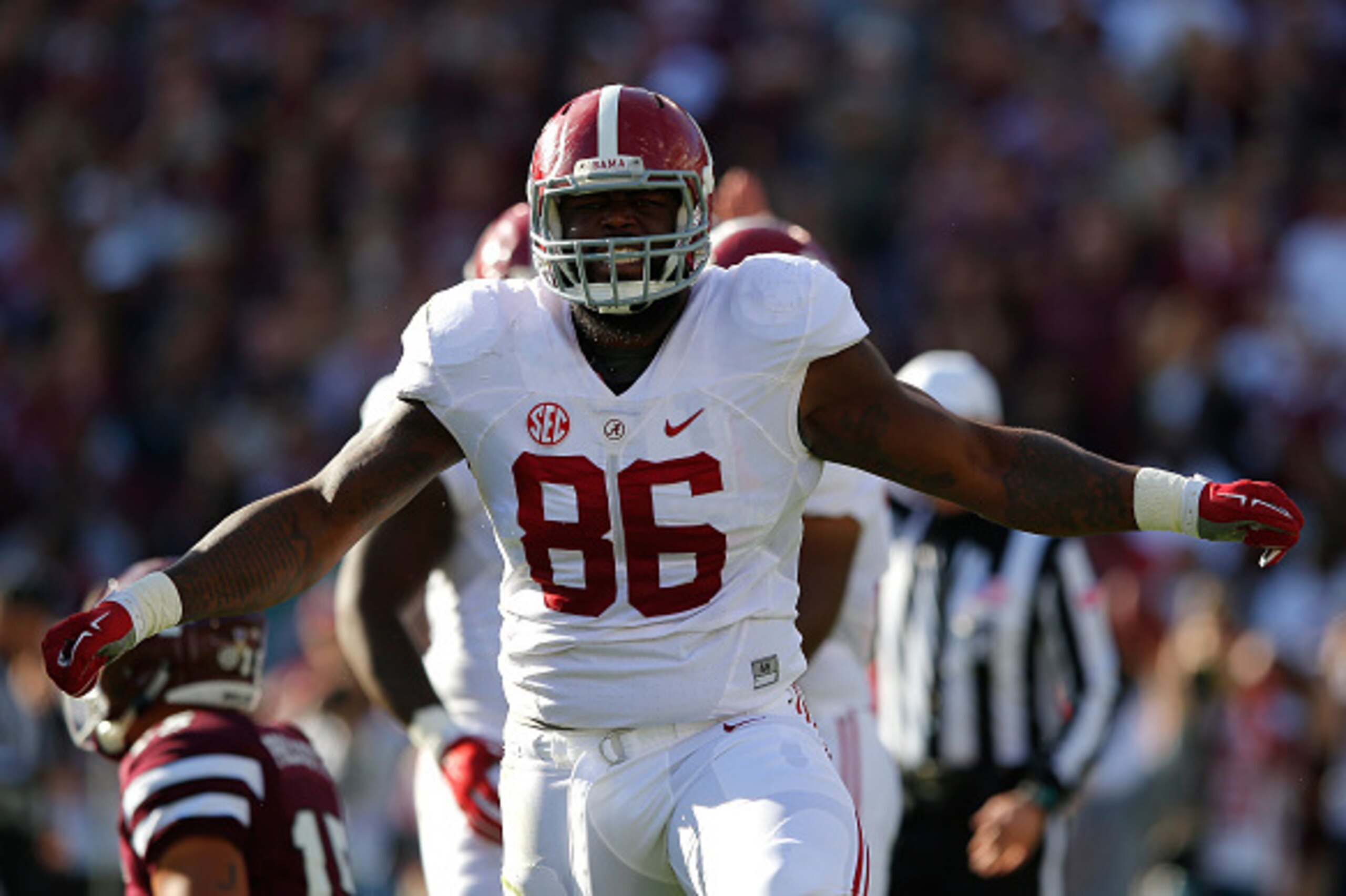 STARKVILLE, MS - NOVEMBER 14:  A'Shawn Robinson #86 of the Alabama Crimson Tide reacts after sacking Dak Prescott #15 of the Mississippi State Bulldogs on the first play of the game at Davis Wade Stadium on November 14, 2015 in Starkville, Mississippi.  (