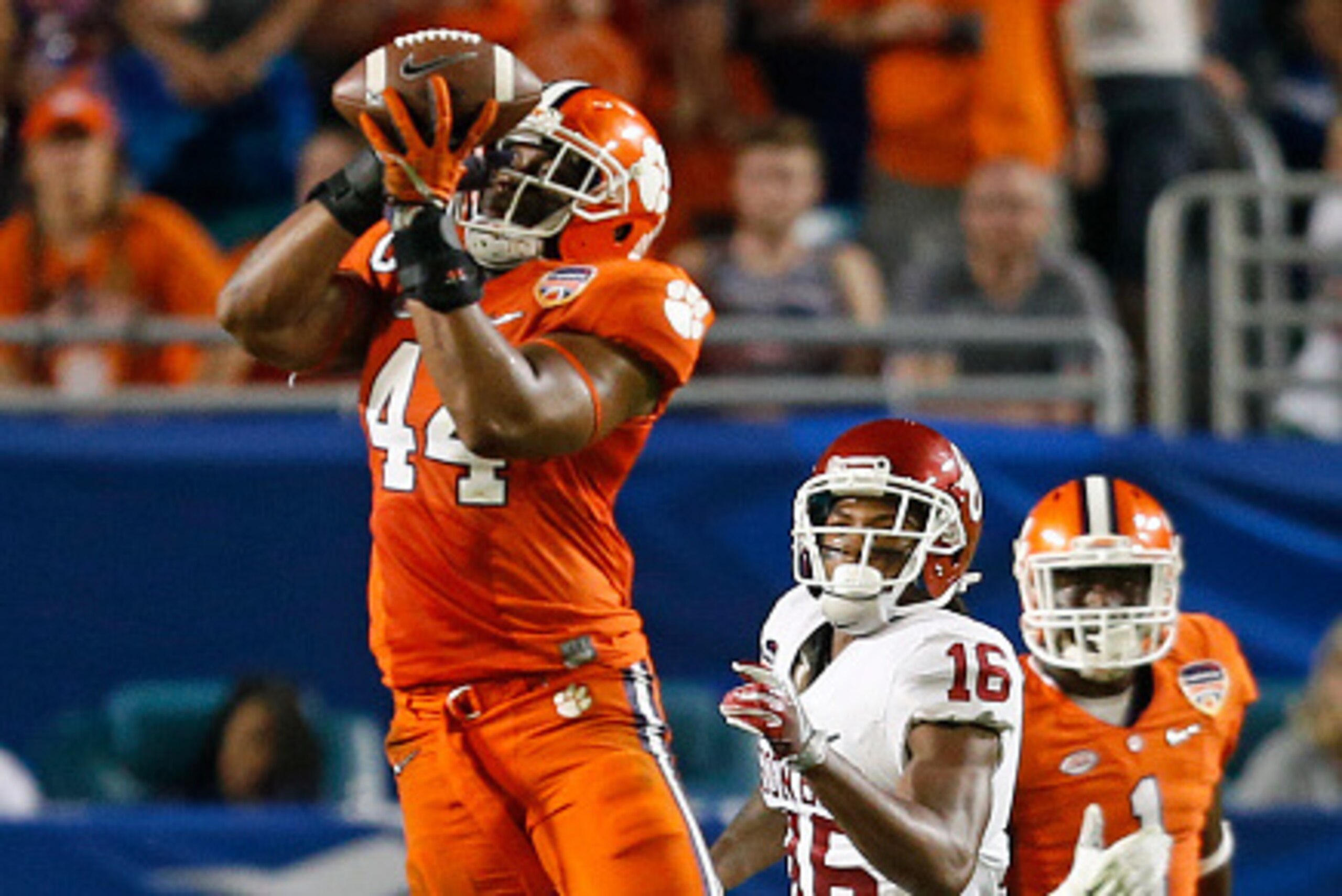 MIAMI GARDENS, FL - DECEMBER 31: B.J. Goodson #44 of the Clemson Tigers intercepts the pass intended for Michiah Quick #16 of the Oklahoma Sooners during the 2015 Capital One Orange Bowl at Sun Life Stadium on December 29, 2015 in Miami Gardens, Florida. 