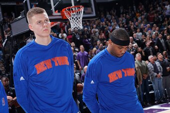 SACRAMENTO, CA - DECEMBER 10: Kristaps Porzingis #6 and Carmelo Anthony #7 of the New York Knicks look on during the national anthem of the game against the Sacramento Kings on December 10, 2015 at Sleep Train Arena in Sacramento, California. NOTE TO USER