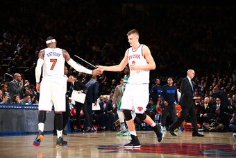 NEW YORK, NY - DECEMBER 7:  Kristaps Porzingis #6 of the New York Knicks shakes hands with Carmelo Anthony #7 of the New York Knicks during the game against the Dallas Mavericks on December 7, 2015 at Madison Square Garden in New York City, New York.  NOT