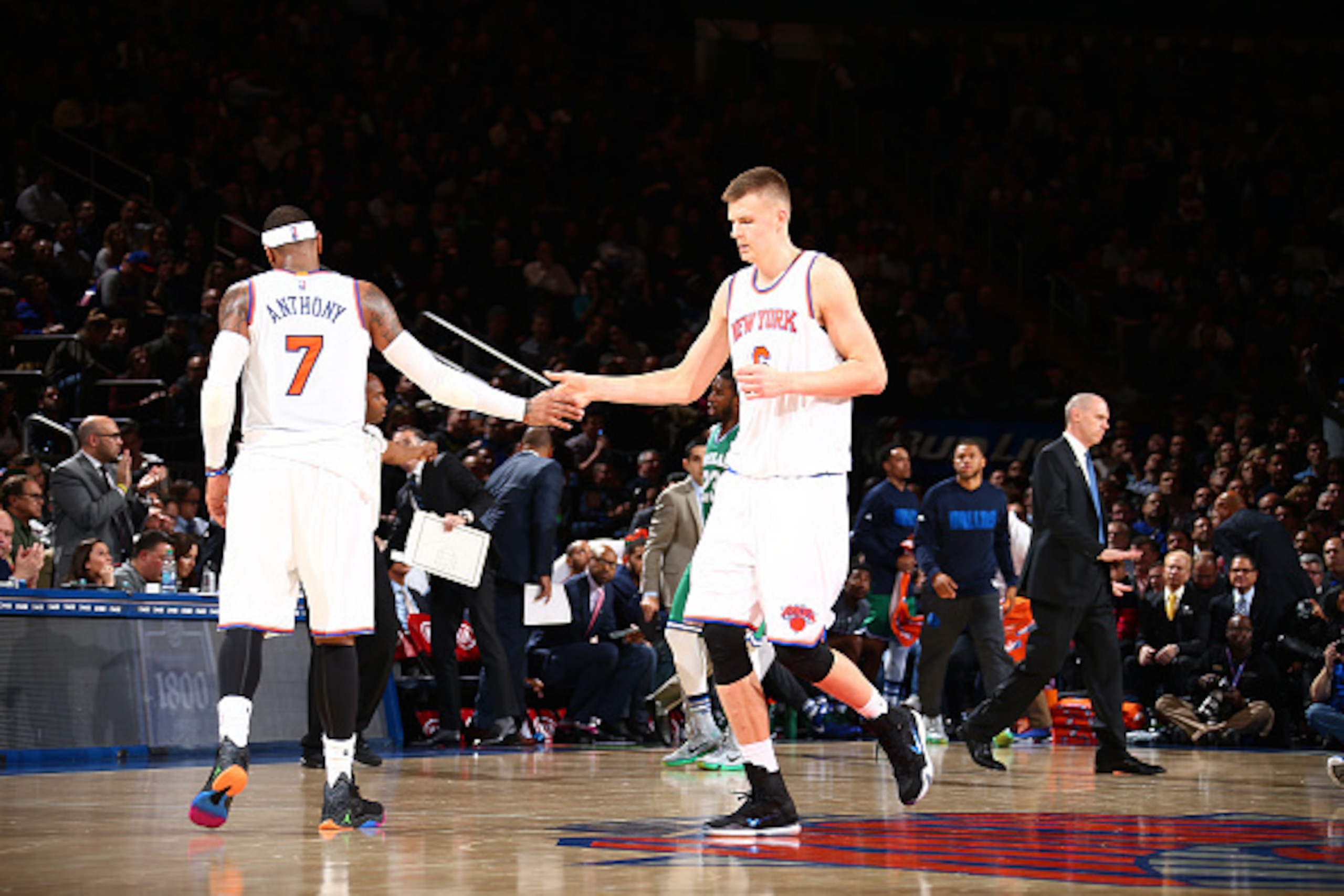 NEW YORK, NY - DECEMBER 7:  Kristaps Porzingis #6 of the New York Knicks shakes hands with Carmelo Anthony #7 of the New York Knicks during the game against the Dallas Mavericks on December 7, 2015 at Madison Square Garden in New York City, New York.  NOT