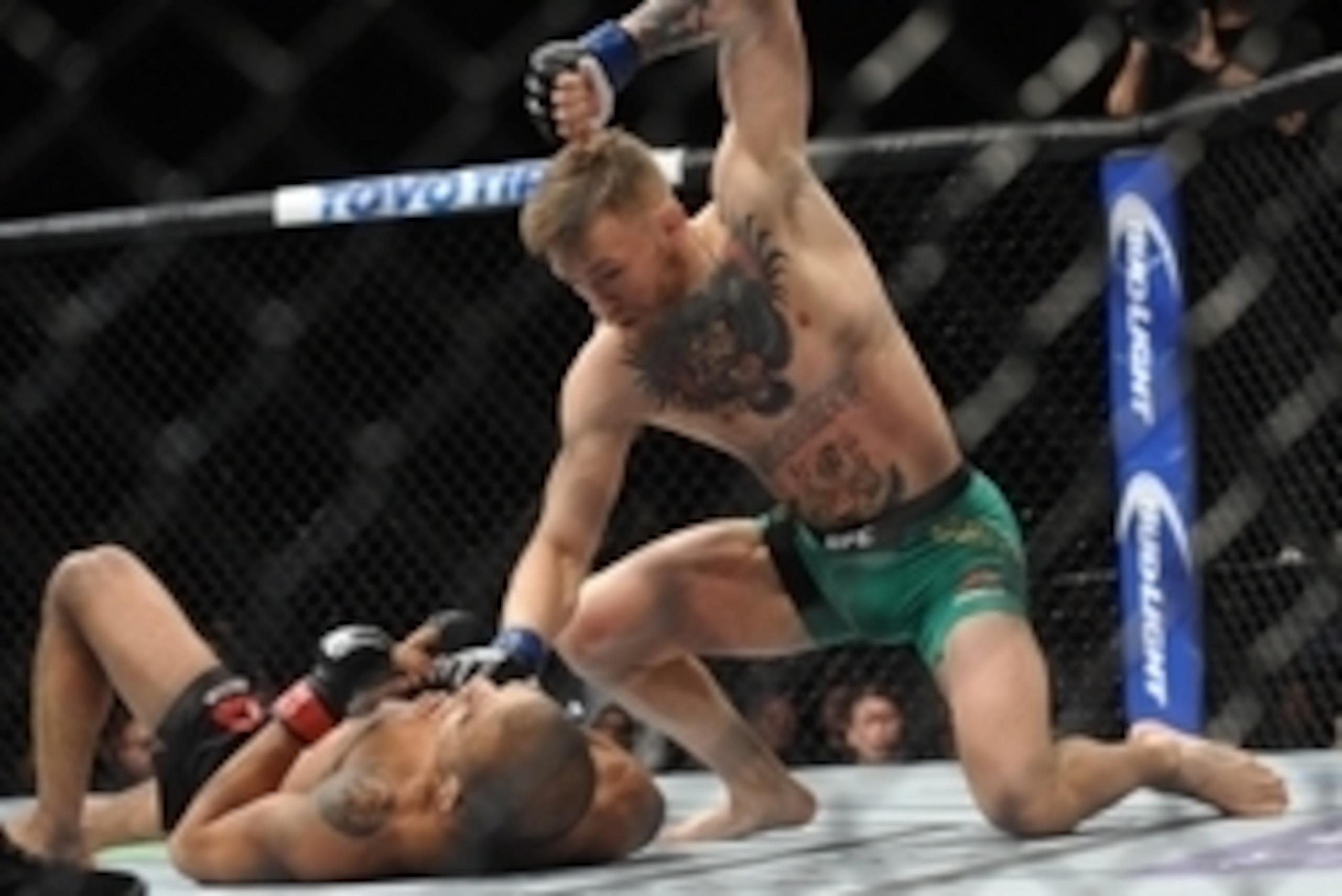 December 12, 2015; Las Vegas, NV, USA; Conor McGregor lands punches to win via technical knockout  against Jose Aldo during UFC 194 at MGM Grand Garden Arena. Mandatory Credit: Gary A. Vasquez-USA TODAY Sports