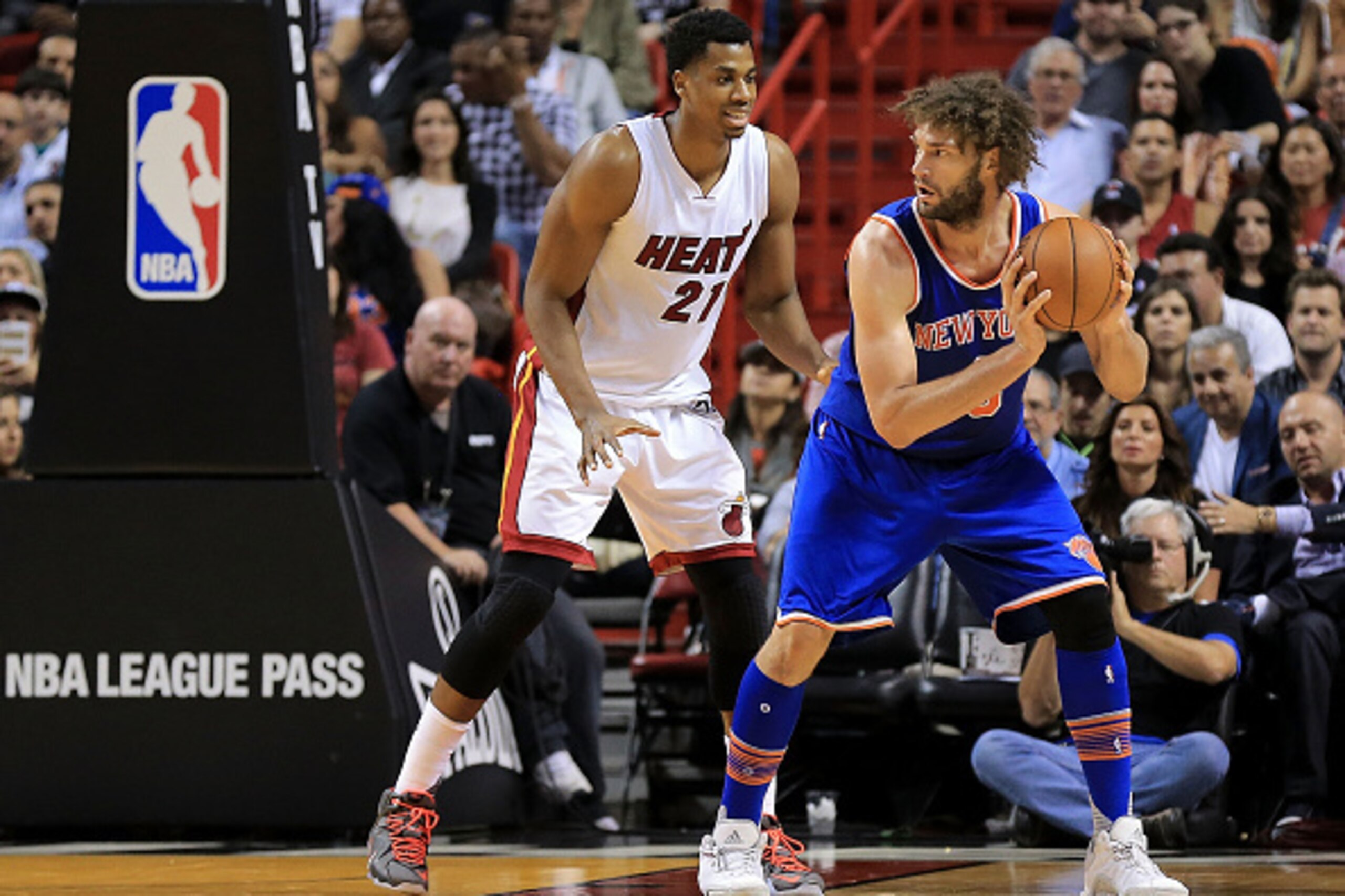 MIAMI, FL - JANUARY 06: Robin Lopez #8 of the New York Knicks posts up Hassan Whiteside #21 of the Miami Heat during a game  at American Airlines Arena on January 6, 2016 in Miami, Florida. NOTE TO USER: User expressly acknowledges and agrees that, by dow