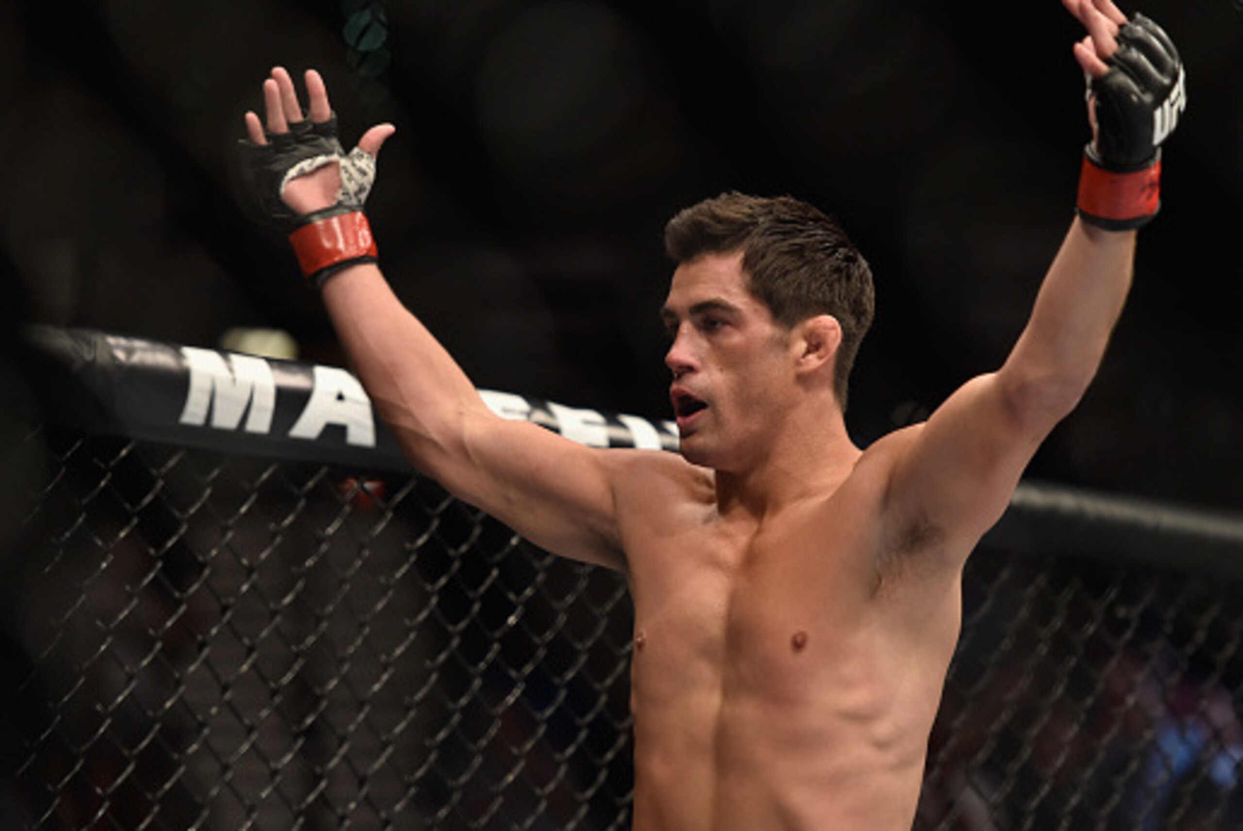 LAS VEGAS, NV - SEPTEMBER 27:  Dominick Cruz celebrates after his TKO victory over Takeya Mizugaki in their bantamweight fight during the UFC 178 event inside the MGM Grand Garden Arena on September 27, 2014 in Las Vegas, Nevada.  (Photo by Jeff Bottari/Z