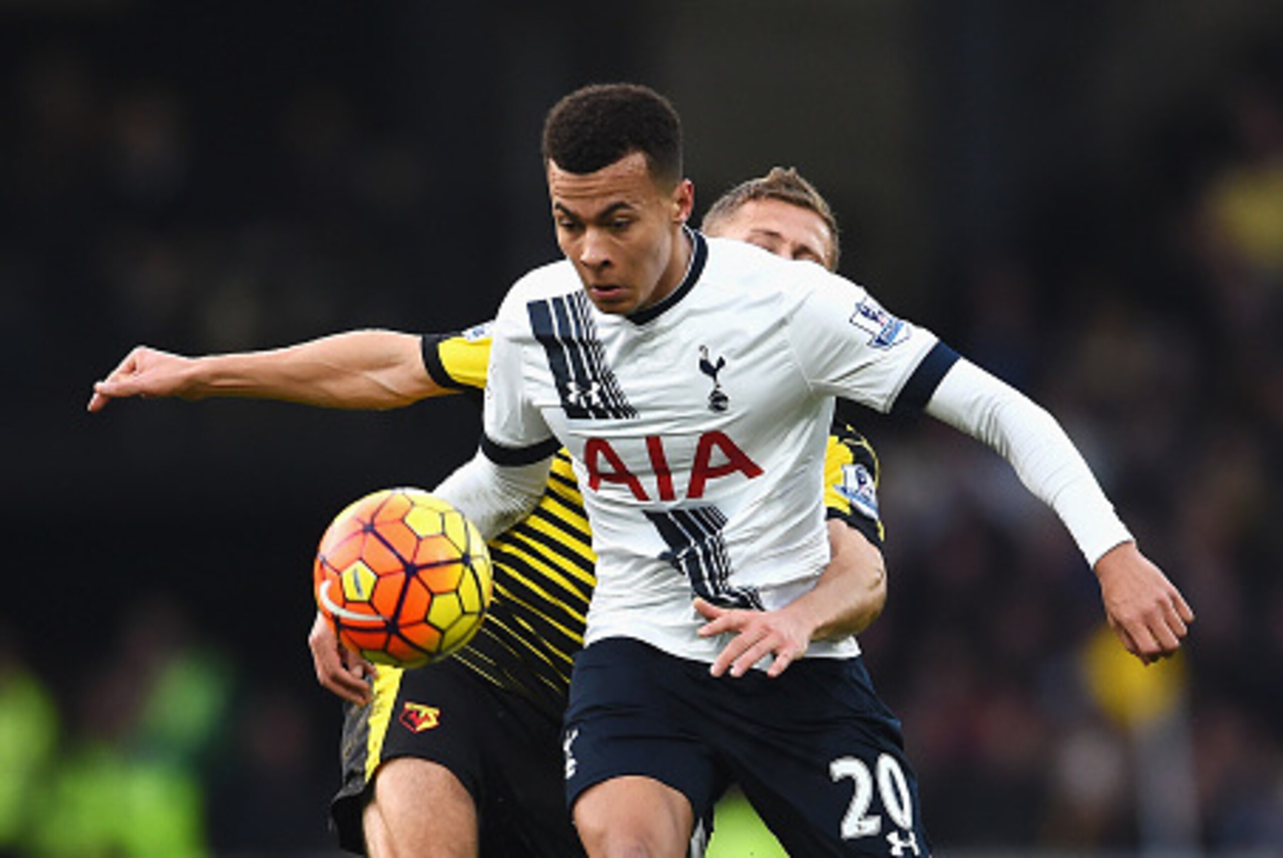 WATFORD, ENGLAND - DECEMBER 28: Dele Alli of Tottenham Hotspur and Almen Abdi of Watford compete for the ball during the Barclays Premier League match between Watford and Tottenham Hotspur at Vicarage Road on December 28, 2015 in Watford, England.  (Photo