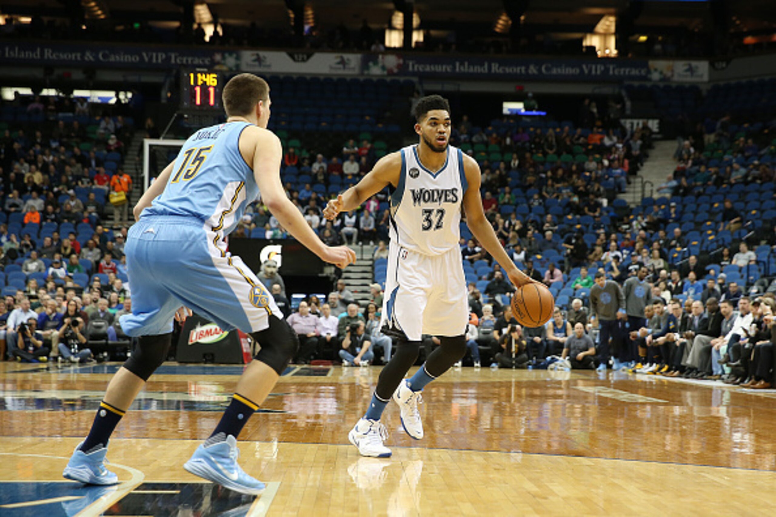 MINNEAPOLIS, MN -  JANUARY 6:  Karl-Anthony Towns #32 of the Minnesota Timberwolves handles the ball against the Denver Nuggets on January 6, 2016 at Target Center in Minneapolis, Minnesota. NOTE TO USER: User expressly acknowledges and agrees that, by do
