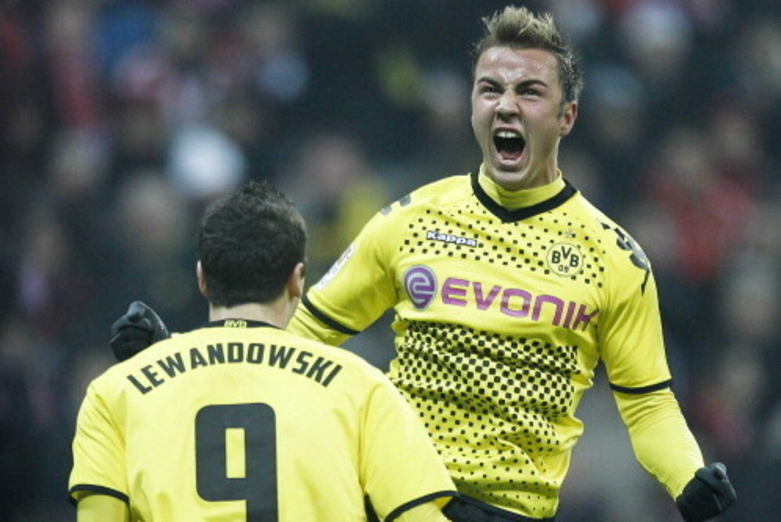 Dortmund's midfielder Mario Goetze (R) celebrates his goal next to Dortmund's Polish striker Robert Lewandowski during the German first division Bundesliga football match between FC Bayern Munich and Borussia Dortmund in the arena in Munich, southern Ger Dortmund's midfielder Mario Goetze (R) celebrates his goal next to Dortmund's Polish striker Robert Lewandowski during the German first division Bundesliga football match between FC Bayern Munich and Borussia Dortmund in the arena in Munich, southern Ger