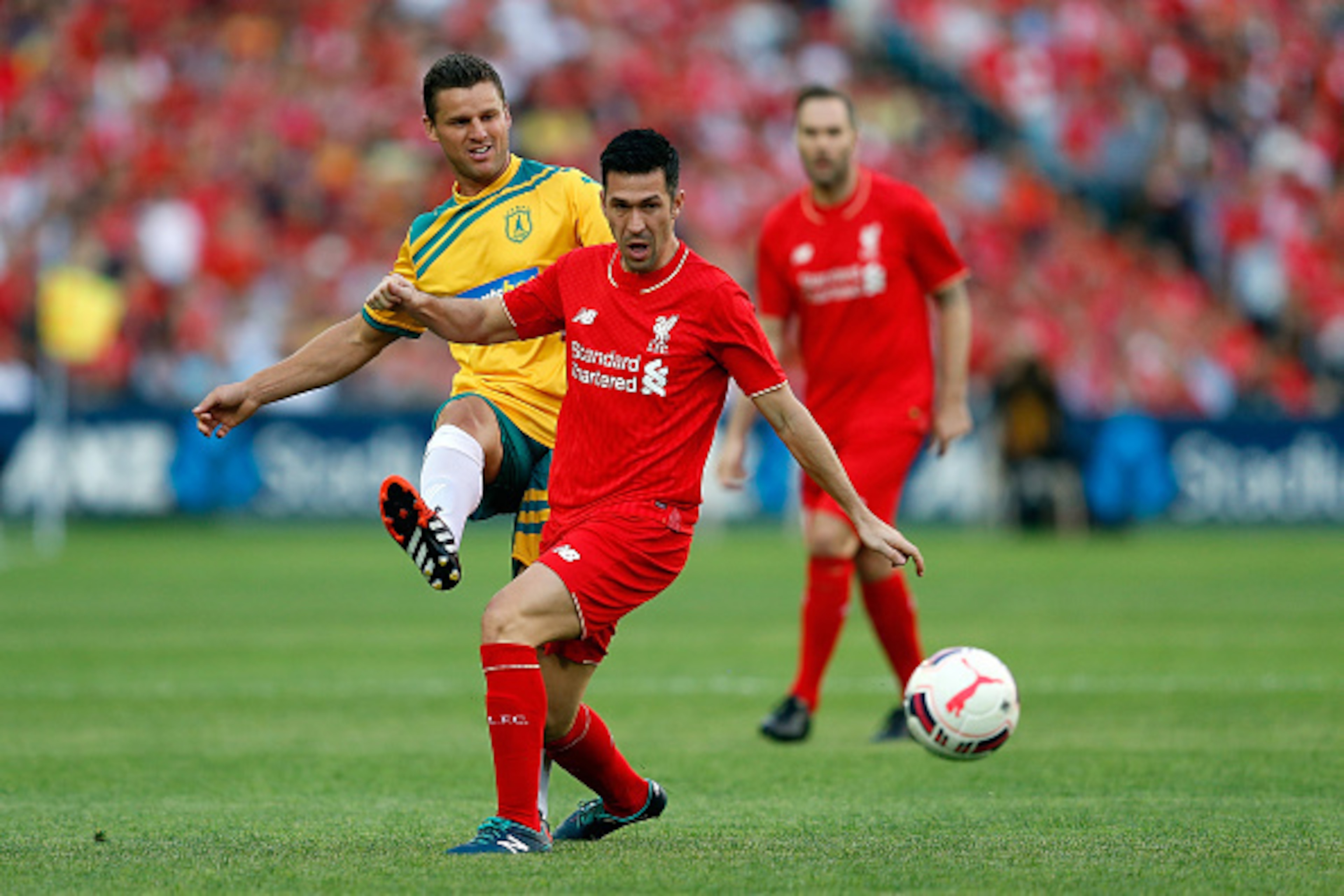 SYDNEY, AUSTRALIA - JANUARY 07: Jason Culina of the Australian Legends competes with Luis Garcia of the Liverpool Legends during the match between Liverpool FC Legends and the Australian Legends at ANZ Stadium on January 7, 2016 in Sydney, Australia. (Ph SYDNEY, AUSTRALIA - JANUARY 07: Jason Culina of the Australian Legends competes with Luis Garcia of the Liverpool Legends during the match between Liverpool FC Legends and the Australian Legends at ANZ Stadium on January 7, 2016 in Sydney, Australia. (Ph