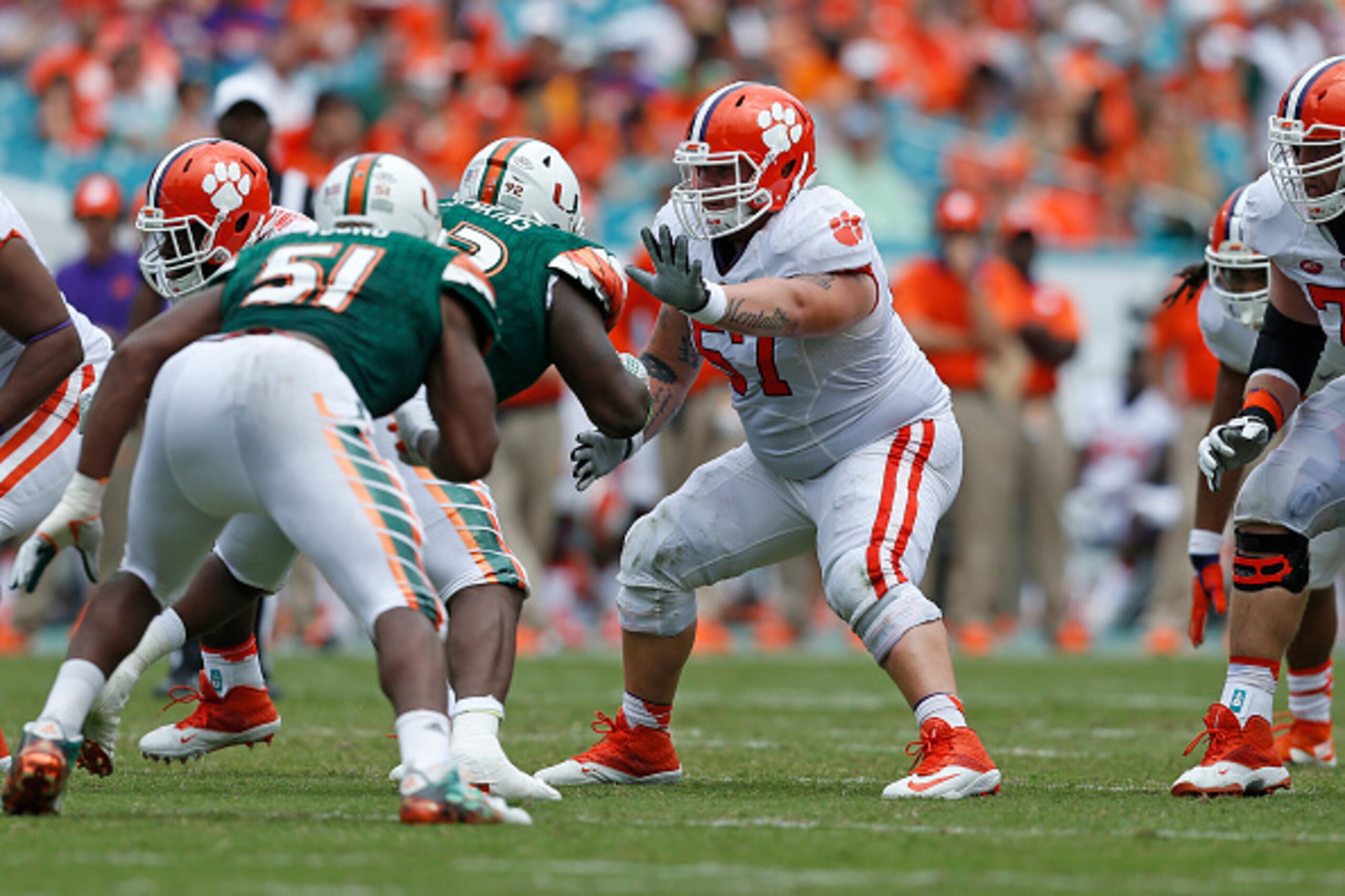 MIAMI GARDENS, FL - OCTOBER 24: Jay Guillermo #57 of the Clemson Tigers defends against Courtel Jenkins #92 of the Miami Hurricanes on October 24, 2015 at Sun Life Stadium in Miami Gardens, Florida. Clemson defeated Miami 58-0. (Photo by Joel Auerbach/Get