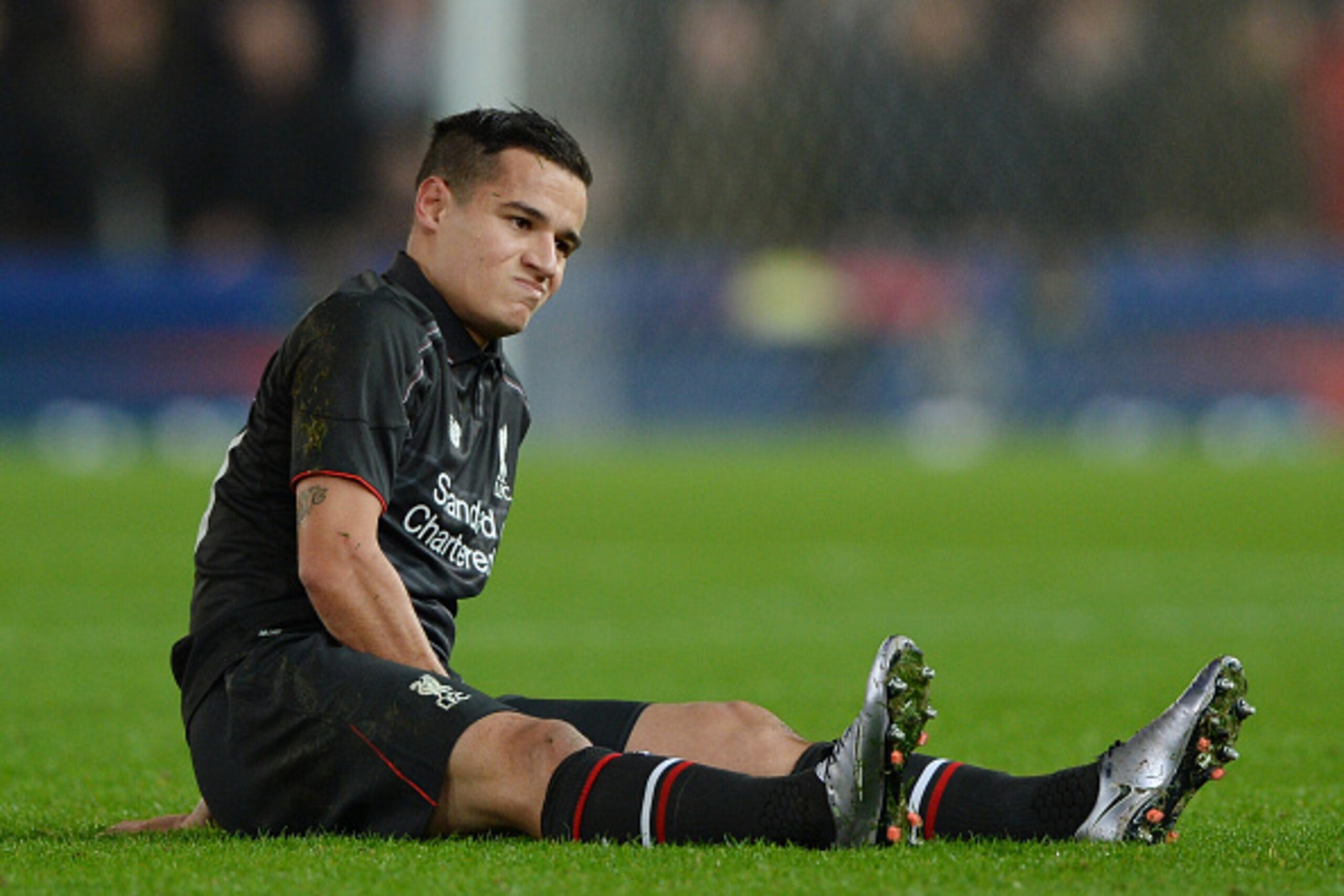 STOKE ON TRENT, ENGLAND - JANUARY 05:  Philippe Coutinho of Liverpool reacts after going down with an injury during the Capital One Cup semi final, first leg match between Stoke City and Liverpool at the Britannia Stadium on January 5, 2016 in Stoke on Tr