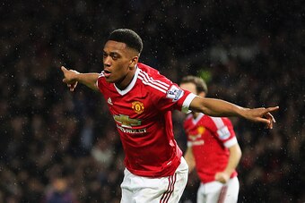 MANCHESTER, ENGLAND - JANUARY 02: Anthony Martial of Manchester United celebrates after scoring a goal to make it 1-0 during the Barclays Premier League match between Manchester United and Swansea City at Old Trafford on January 2, 2016 in Manchester, Eng