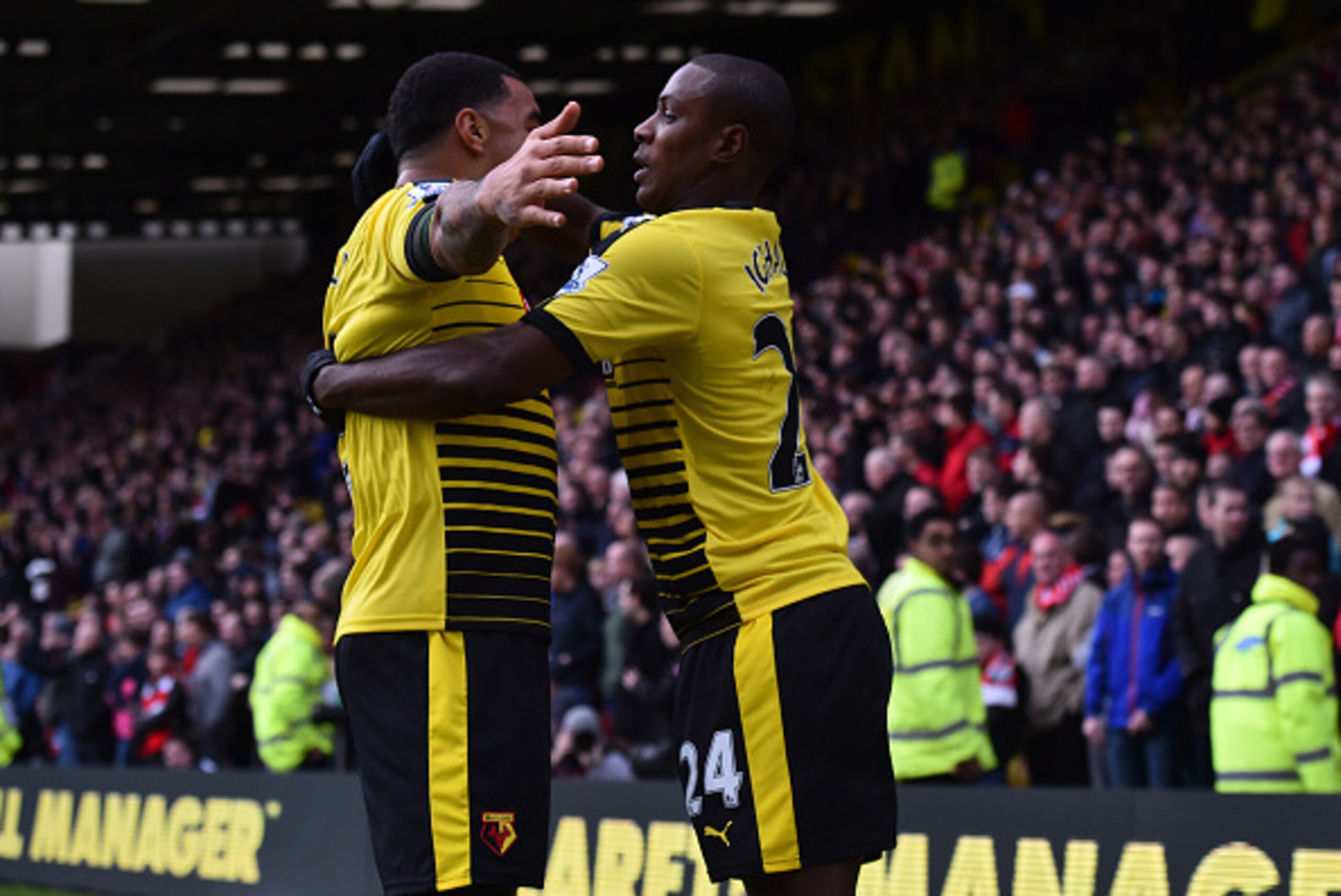 Watford's Nigerian striker Odion Ighalo celebrates with Watford's English striker Troy Deeney (L) after scoring their second goal during the English Premier League football match between Watford and Liverpool at Vicarage Road Stadium in Watford, north of 