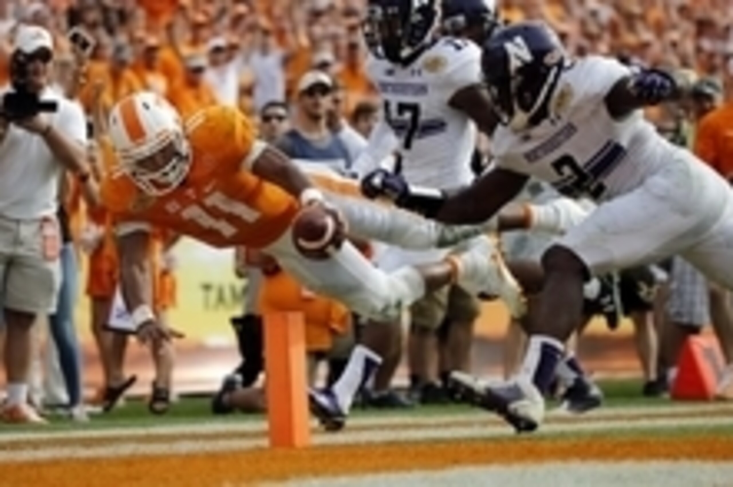 Jan 1, 2016; Tampa, FL, USA; Tennessee Volunteers quarterback Joshua Dobbs (11) runs the ball in for a touchdown against the Northwestern Wildcats during the second half in the 2016 Outback Bowl at Raymond James Stadium. Tennessee Volunteers defeated the 