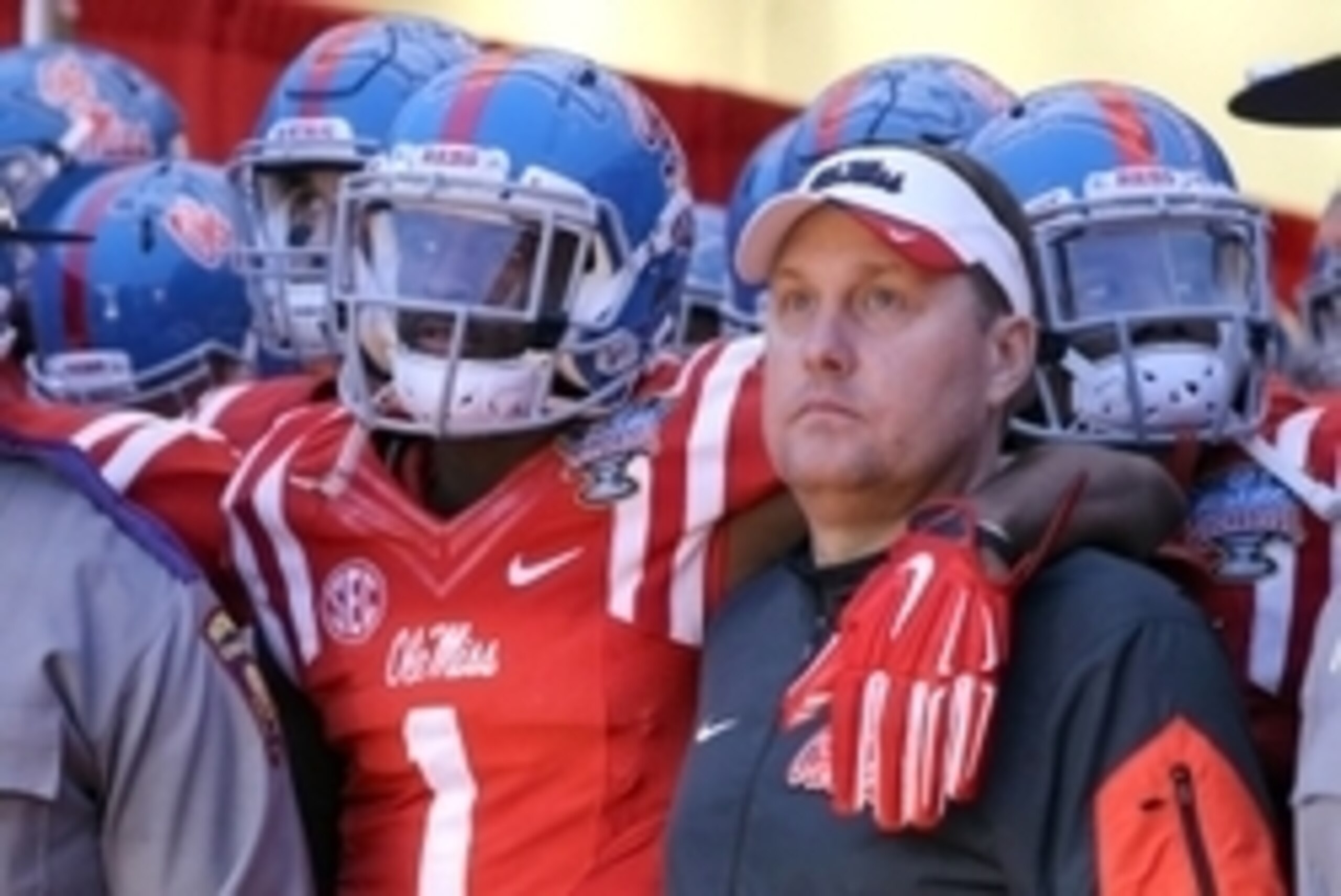 Jan 1, 2016; New Orleans, LA, USA; Mississippi Rebels wide receiver Laquon Treadwell (1) and head coach Hugh Freeze prepares to take the field to play the Oklahoma State Cowboys in the 2016 Sugar Bowl at the Mercedes-Benz Superdome. Mandatory Credit: Chuc