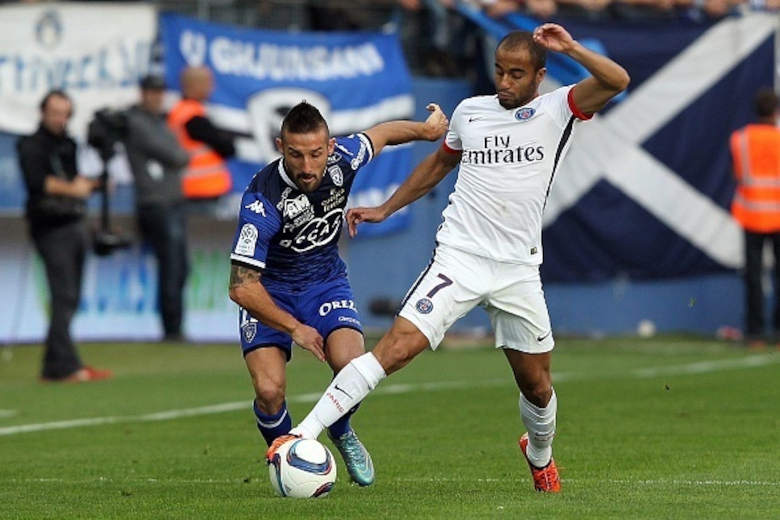 Paris Saint-Germain's Brazilian midfielder Lucas Moura (R) vies with Bastia's French defender Julian Palmieri during the L1 football match Bastia (SCB) against Paris (PSG) on October 17, 2015, at the Armand Cesari stadium in Bastia, on the French Mediterr