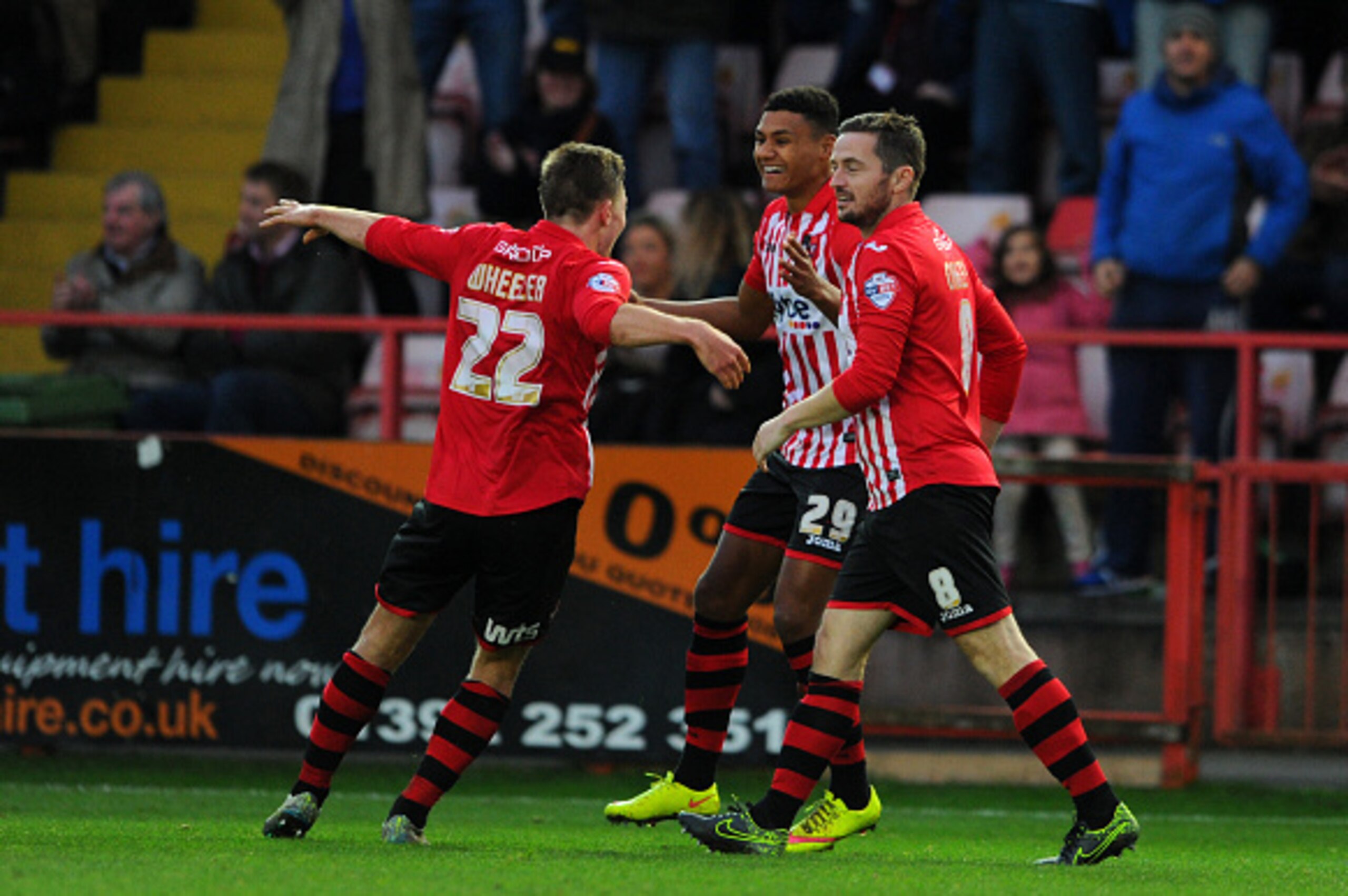 EXETER, ENGLAND - DECEMBER 6: Ollie Watkins of Exeter City(C) celebrates after scoring his sides second goal during the Emirates FA Cup Second Round match between Exeter City and Port Vale at St James Park on December 6, 2015 in Exeter England.  (Photo by