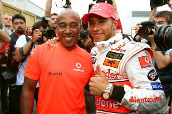 MONTREAL, QC - JUNE 10:  Lewis Hamilton of Great Britain and McLaren Mercedes celebrates with his father Anthony Hamilton in the paddock after winning his first Grand Prix in the Canadian Formula One Grand Prix at the Circuit Gilles Villeneuve on June 10,