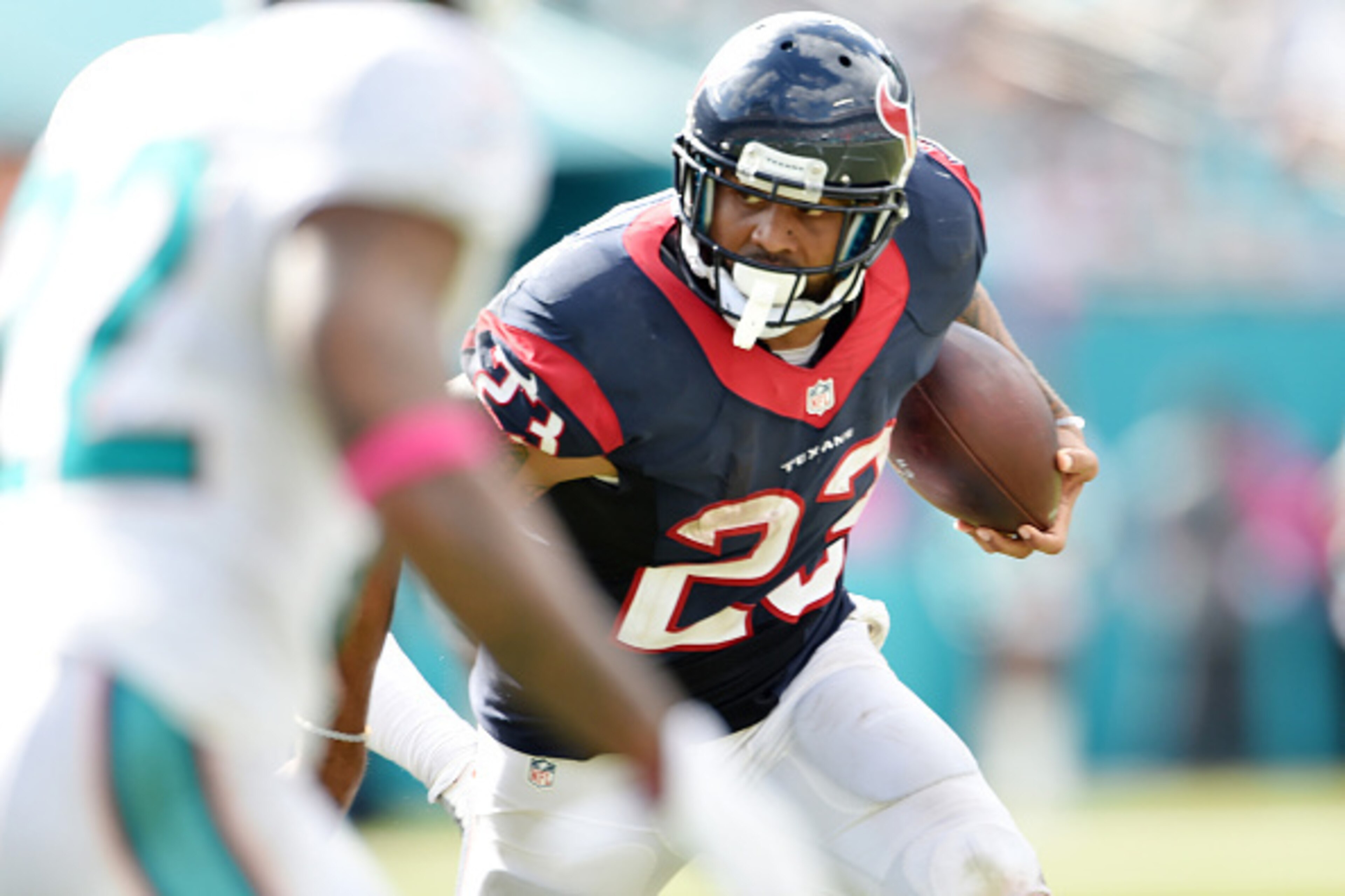 MIAMI GARDENS, FL - OCTOBER 25:  Running back Arian Foster #23 of the Houston Texans carries the ball during a NFL game against the Miami Dolphins at Sun Life Stadium on October 25, 2015 in Miami Gardens, Florida. (Photo by Ronald C. Modra/Sports Imagery/