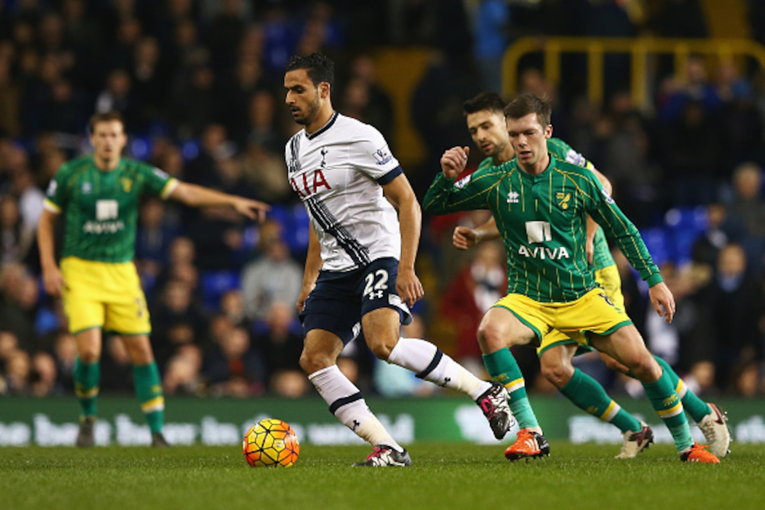 LONDON, ENGLAND - DECEMBER 26: Nacer Chadli of Tottenham Hotspur is closed down by Jonathan Howson of Norwich City during the Barclays Premier League match between Tottenham Hotspur and Norwich City at White Hart Lane on December 26, 2015 in London, Engla
